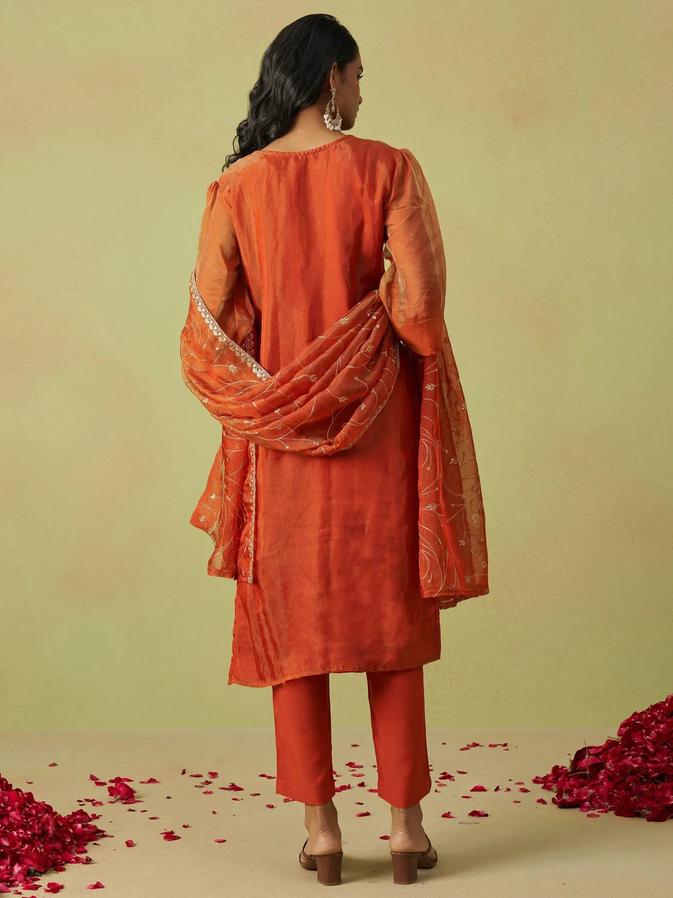 Orange ethnic salwar kameez with embroidered dupatta, perfect for Indian occasions and festive wear.