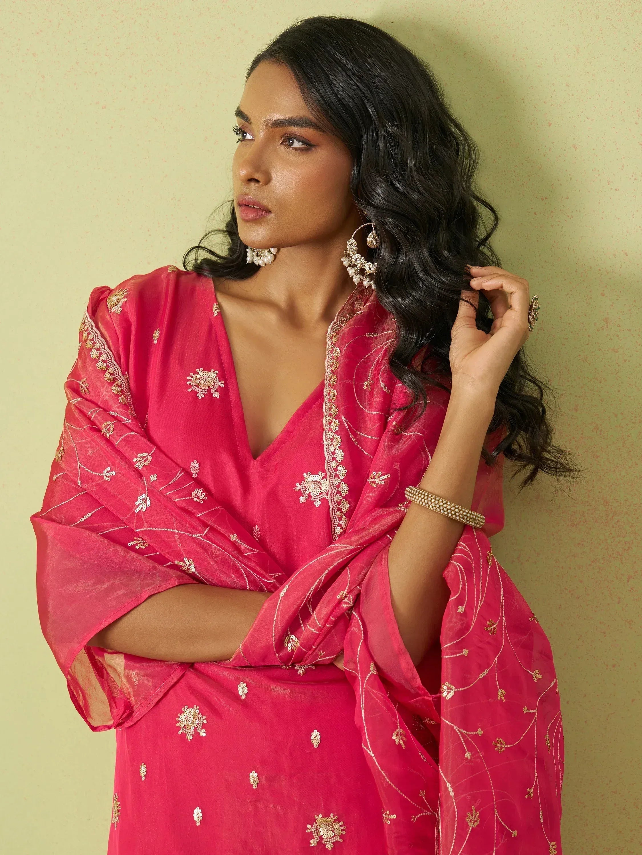 Pink embroidered ethnic gown with gold detailing, perfect for Indian festive wear and special occasions.