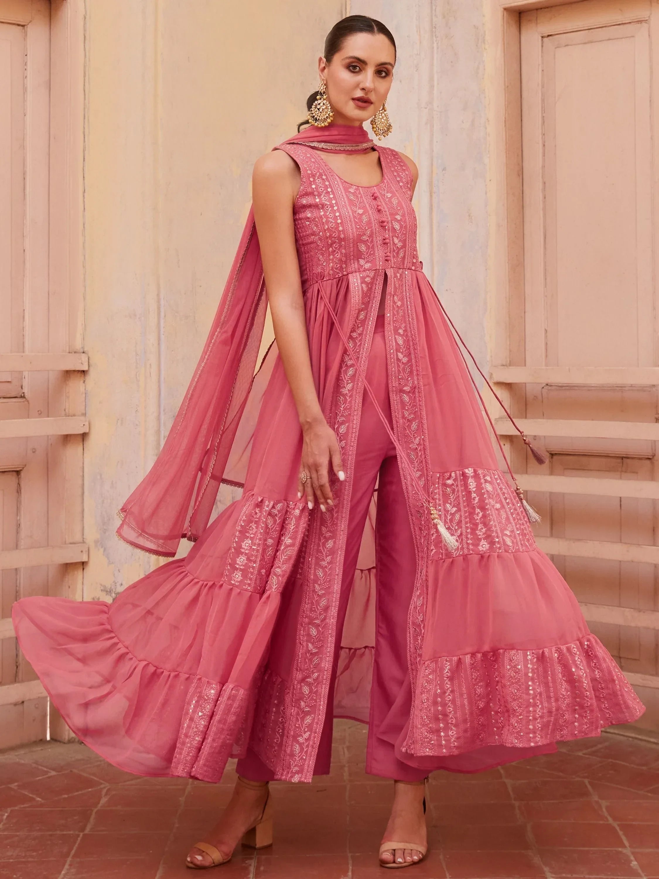 Woman in pink embroidered ethnic Anarkali suit with dupatta and palazzo pants