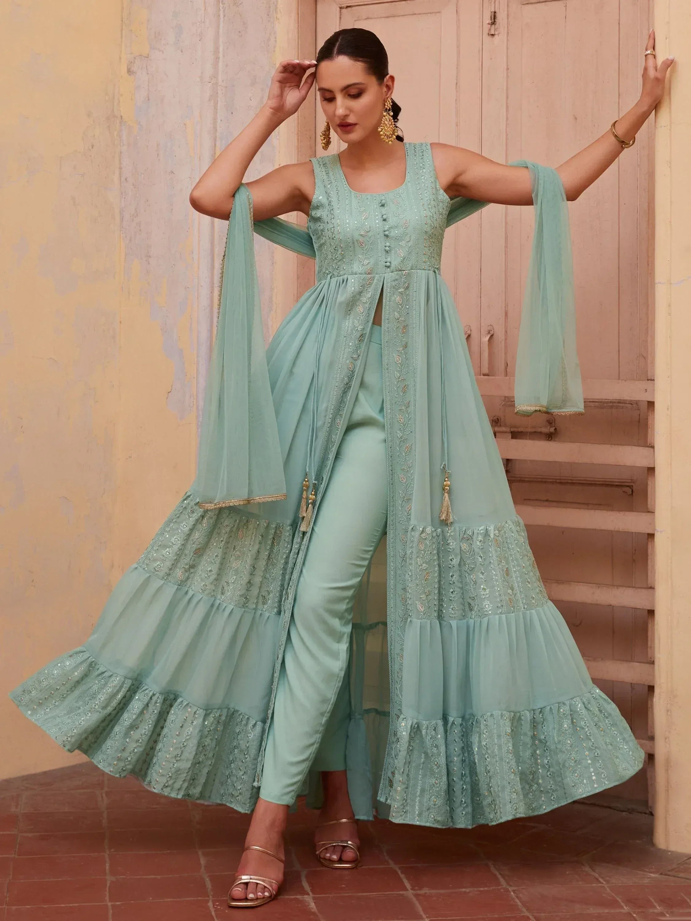 Mint green embroidered anarkali suit with ruffled layers and dupatta, perfect for Indian ethnic occasions