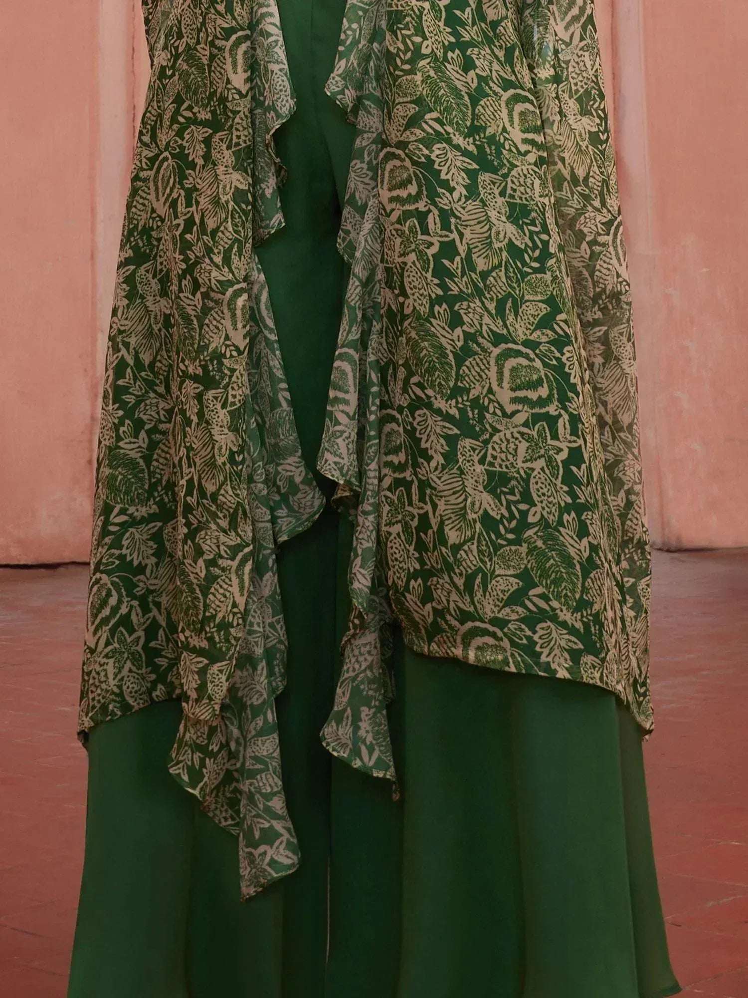 Green floral printed ethnic gown with ruffled overlay, perfect for Indian occasions