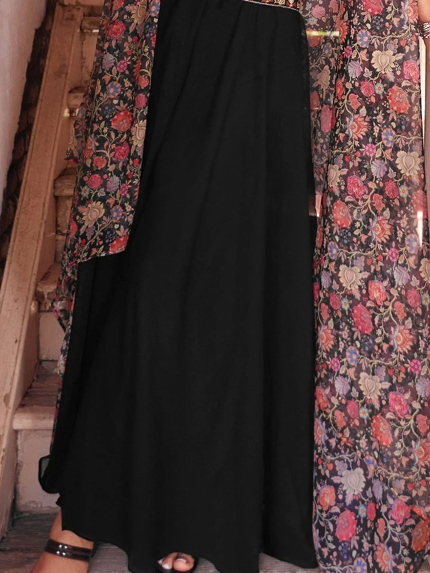 Black ethnic gown with sheer floral dupatta and gold trim, traditional Indian fashion