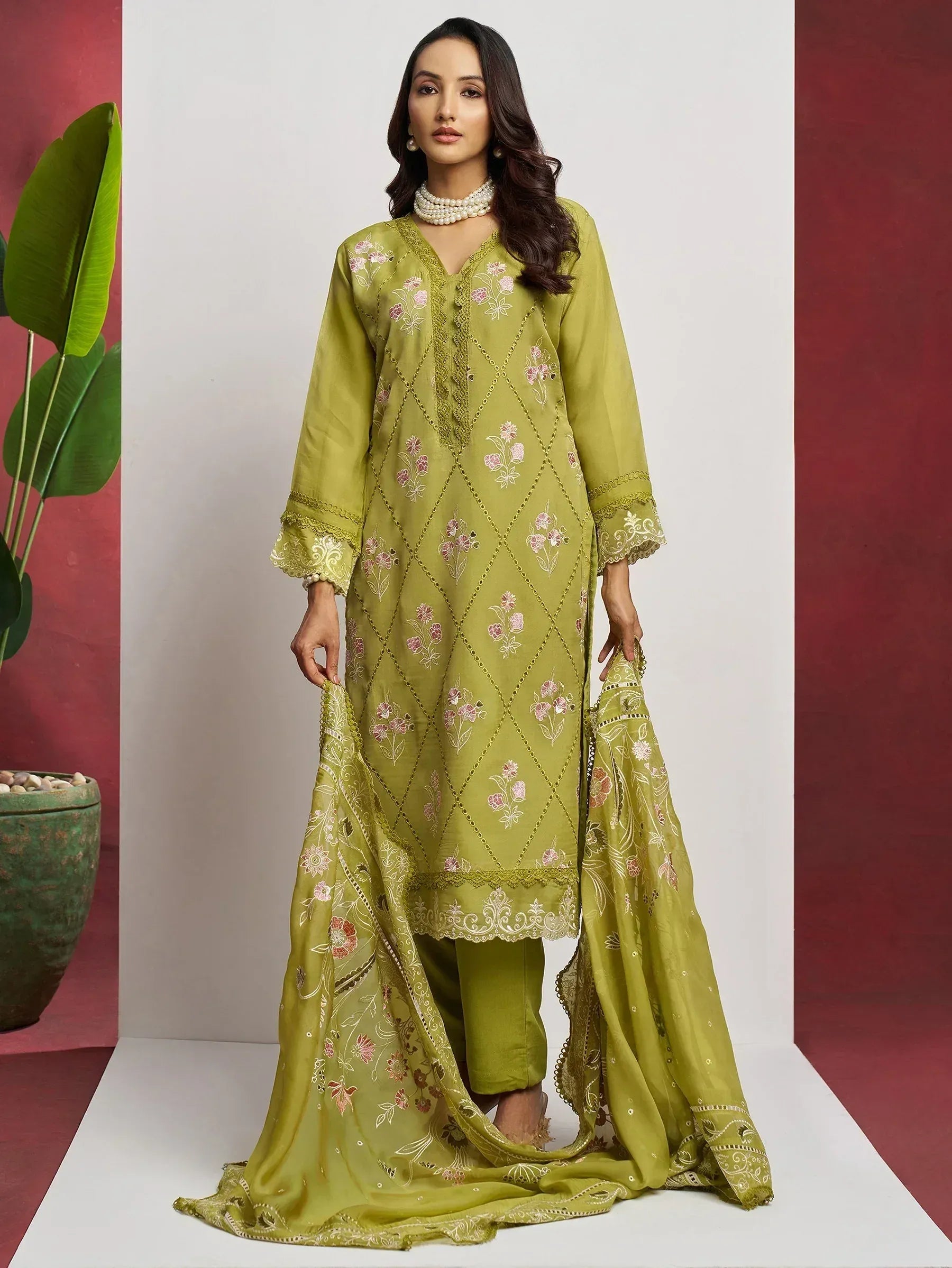Olive green embroidered salwar kameez with floral motifs and matching dupatta, ideal for ethnic occasions.