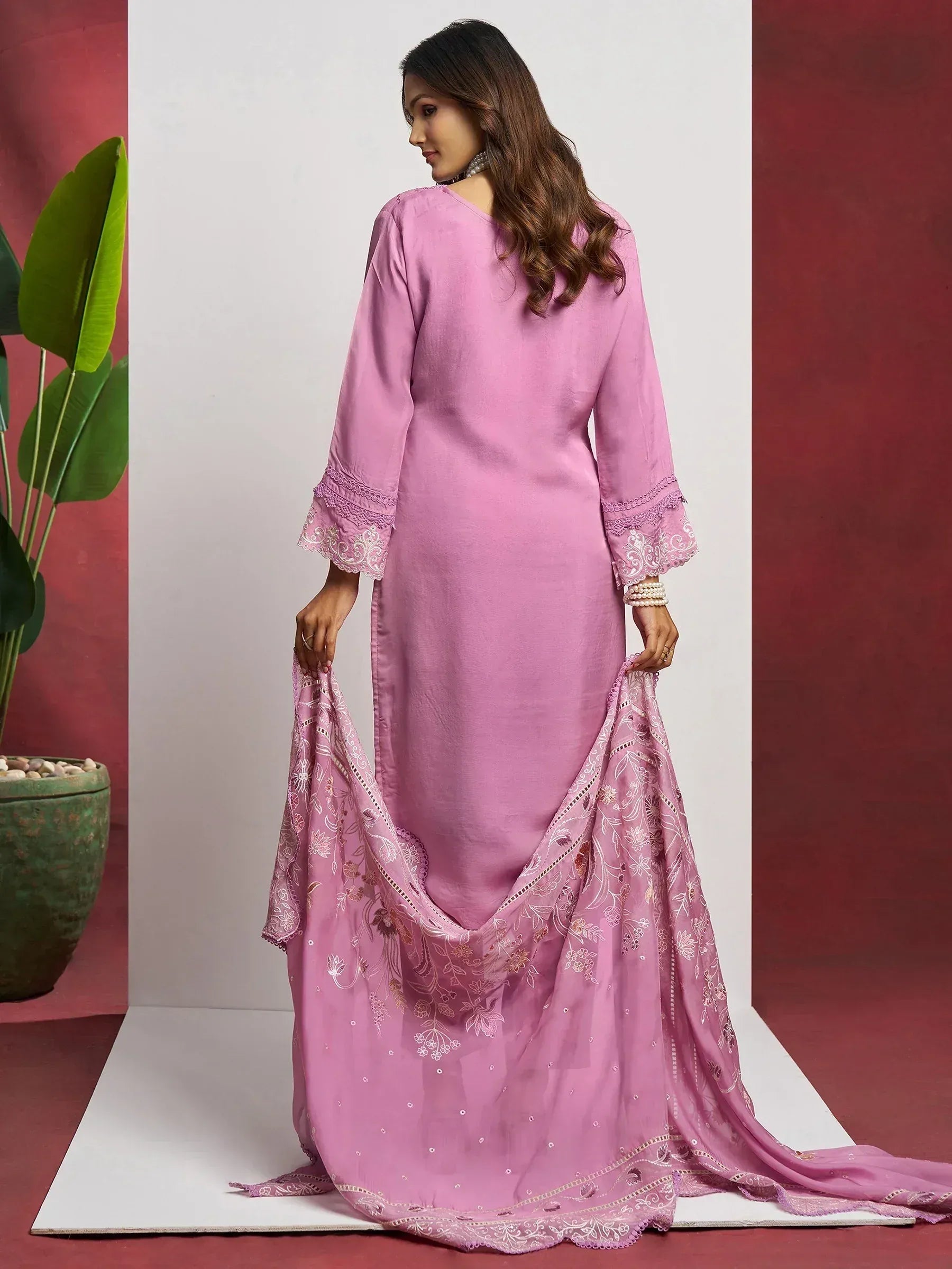 Pink ethnic salwar kameez with embroidered dupatta and lace sleeves, perfect for Indian occasions