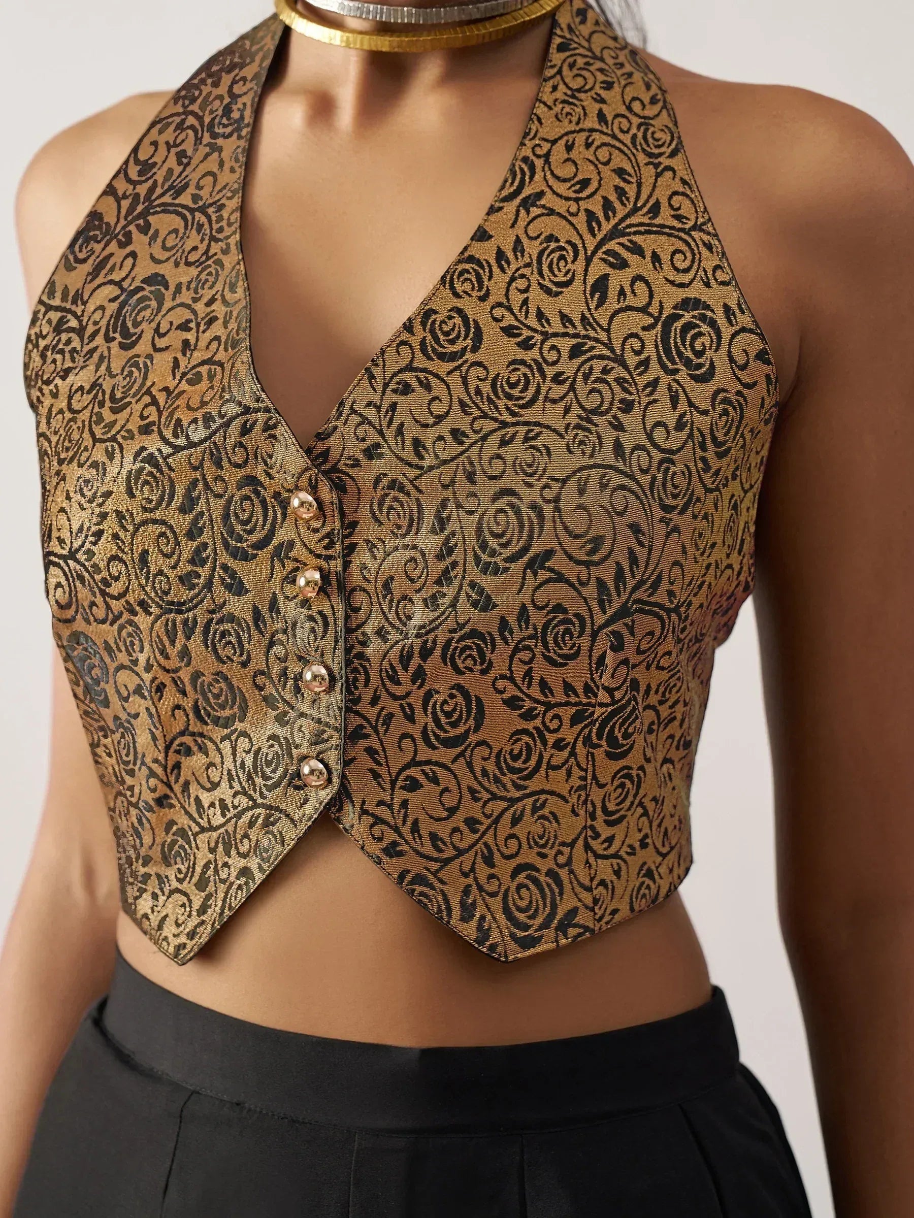 Gold and black floral print halter neck crop top with button front, ethnic wear style
