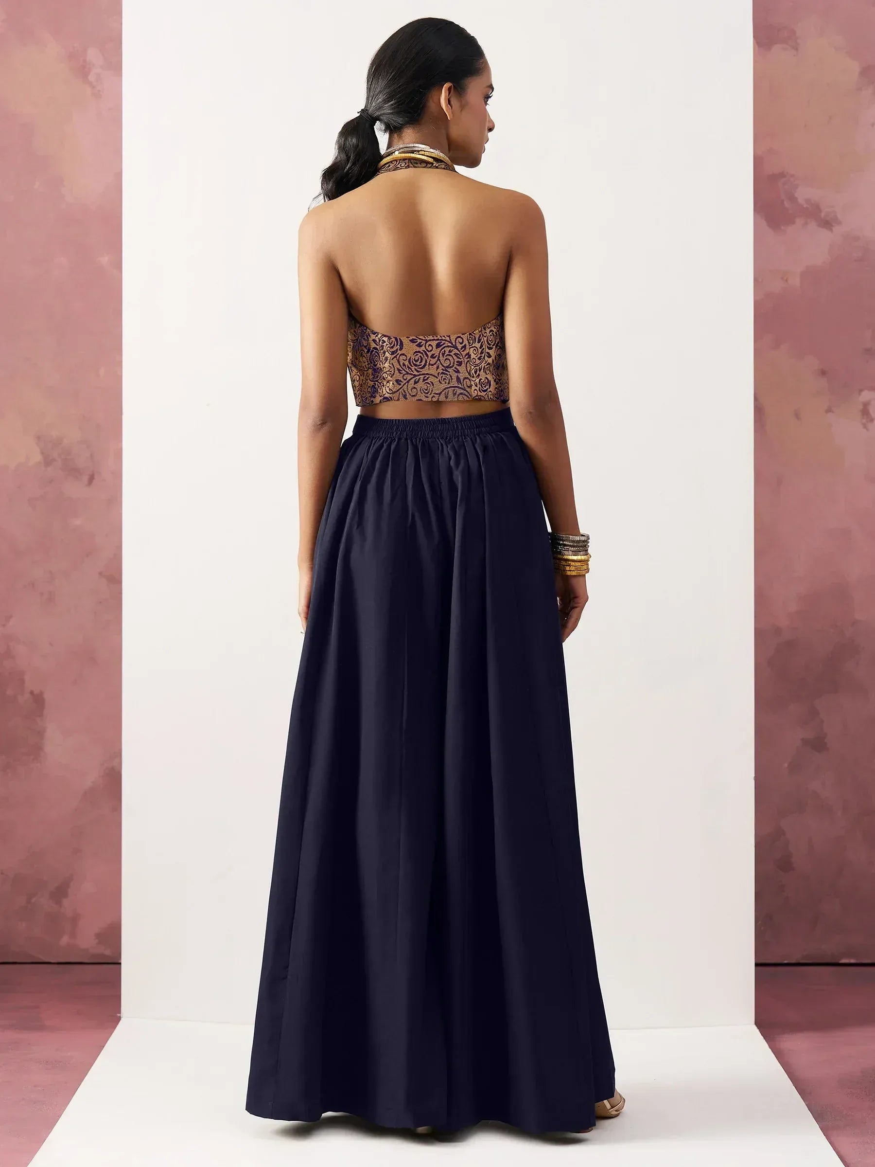 Navy blue ethnic gown with embroidered backless top, perfect for Indian festive occasions