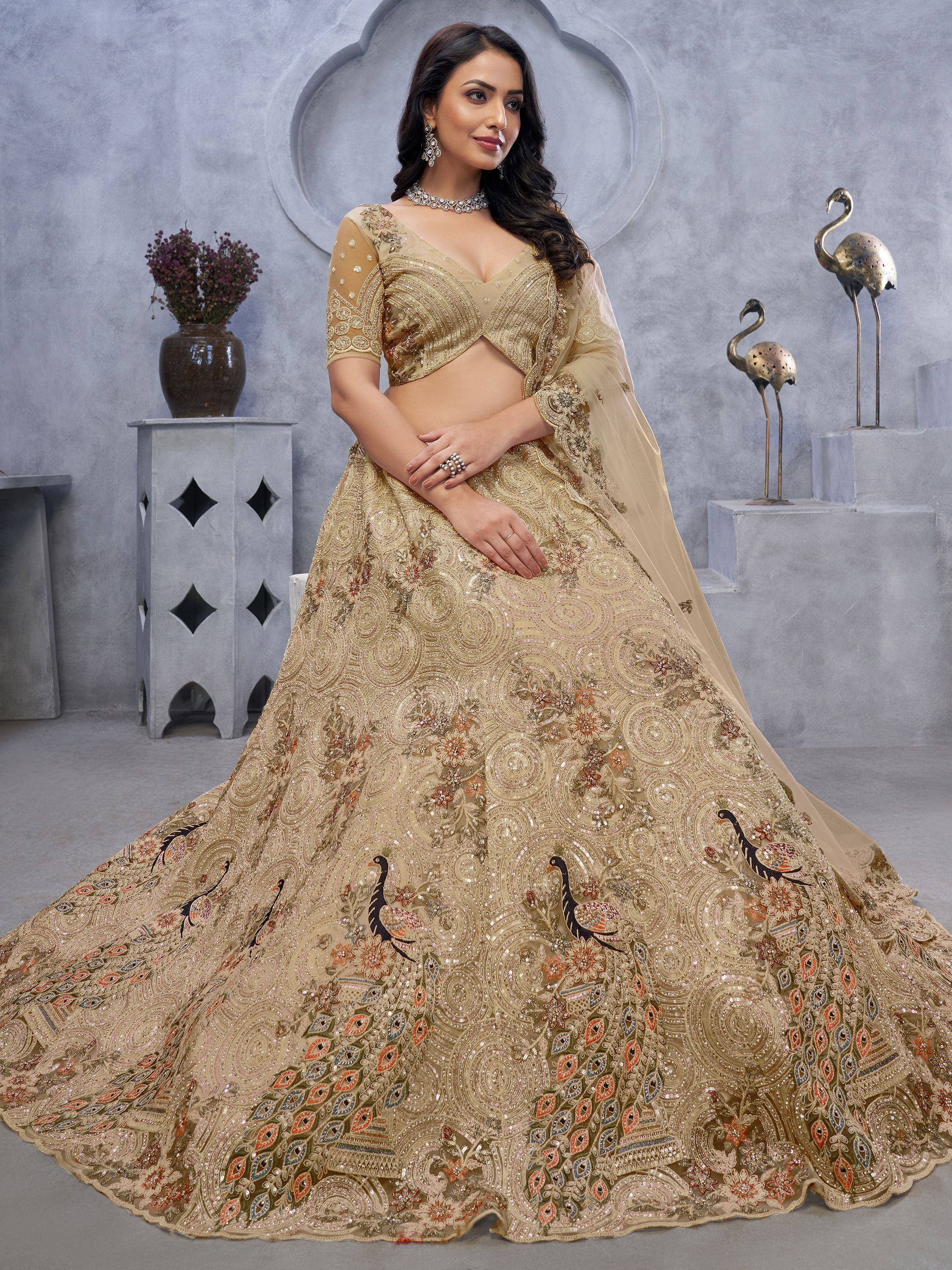Elegant gold lehenga choli with peacock embroidery, perfect for Indian weddings and festive occasions.