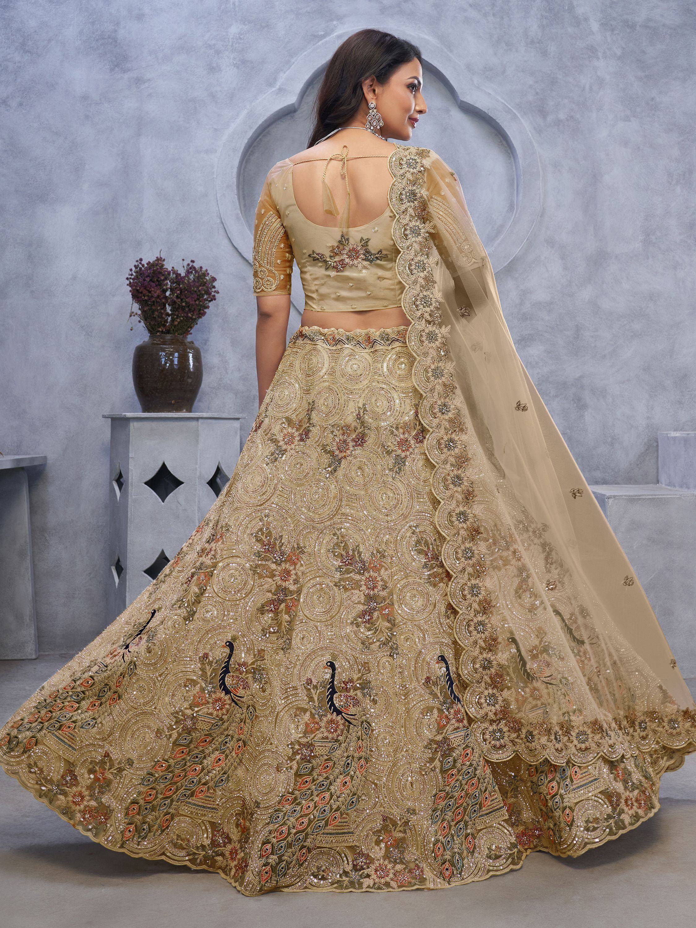 Beige designer lehenga choli with peacock embroidery, floral motifs, and sheer dupatta for Indian ethnic wear