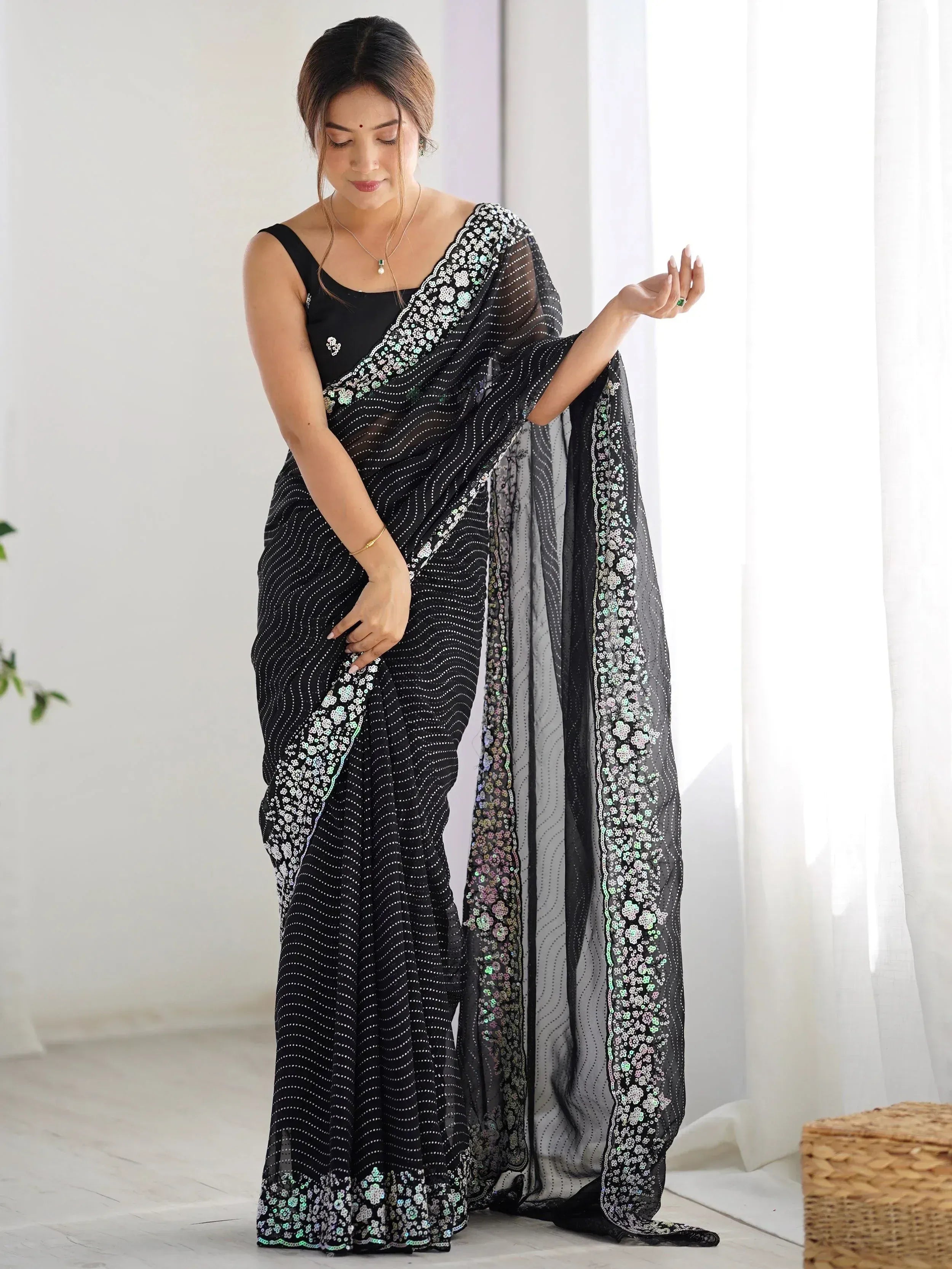 Black sheer saree with sequin floral border, stylish Indian ethnic wear for women