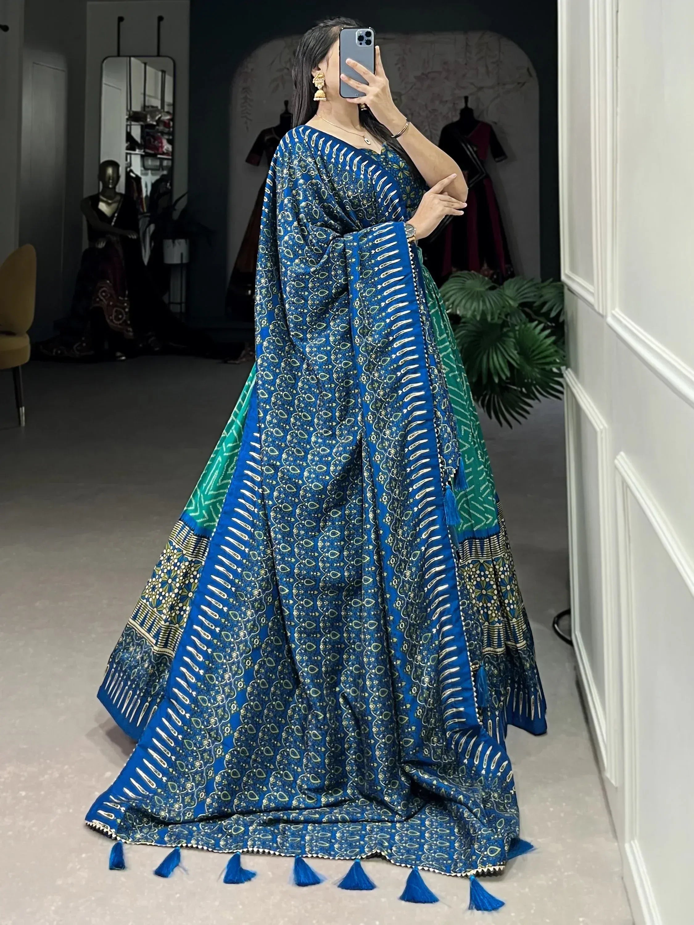 Blue and green printed ethnic gown with tassels, perfect for Indian occasions and festive wear.
