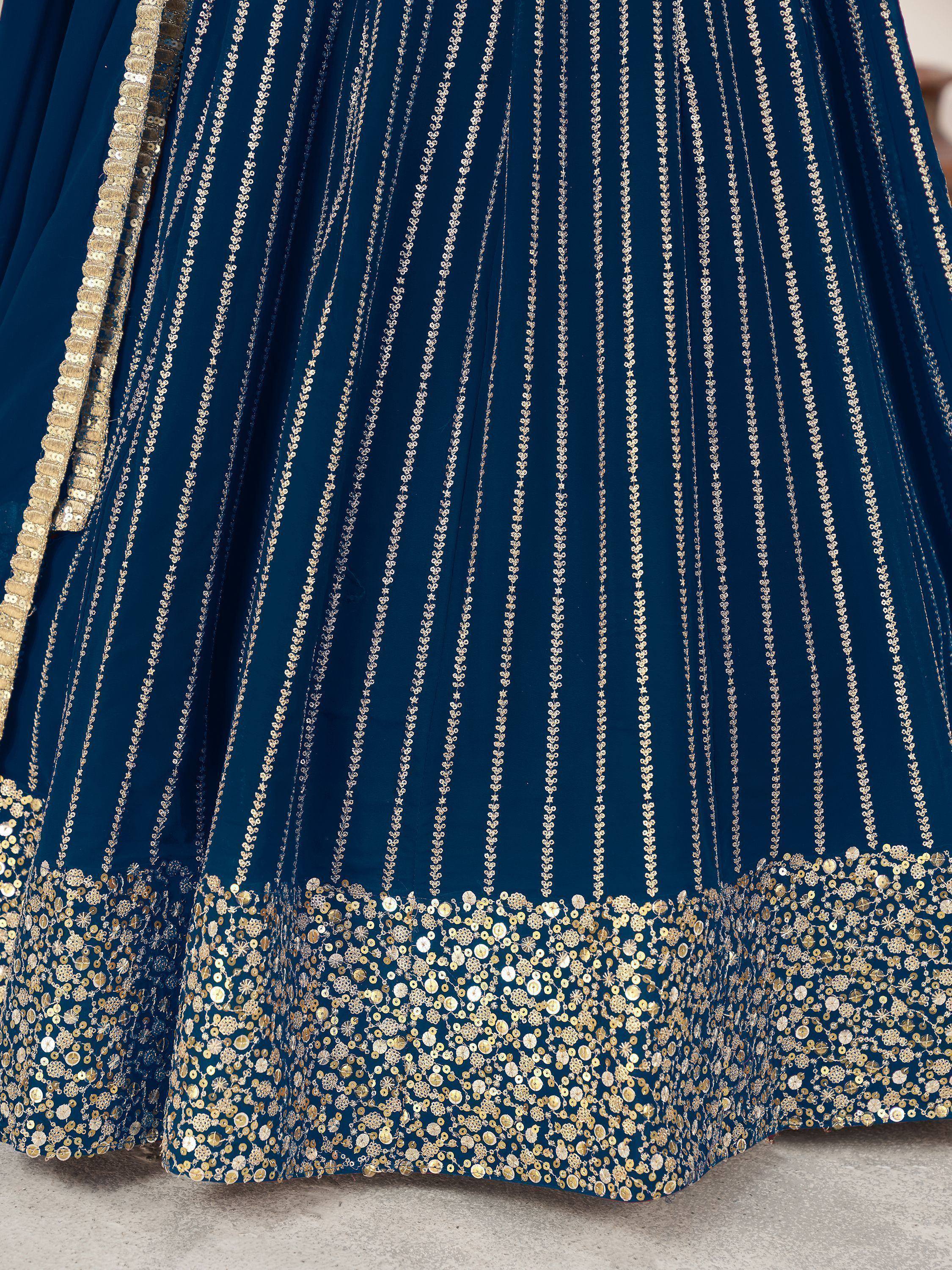 Blue lehenga with gold sequin embroidery and floral detailing, ethnic Indian wear
