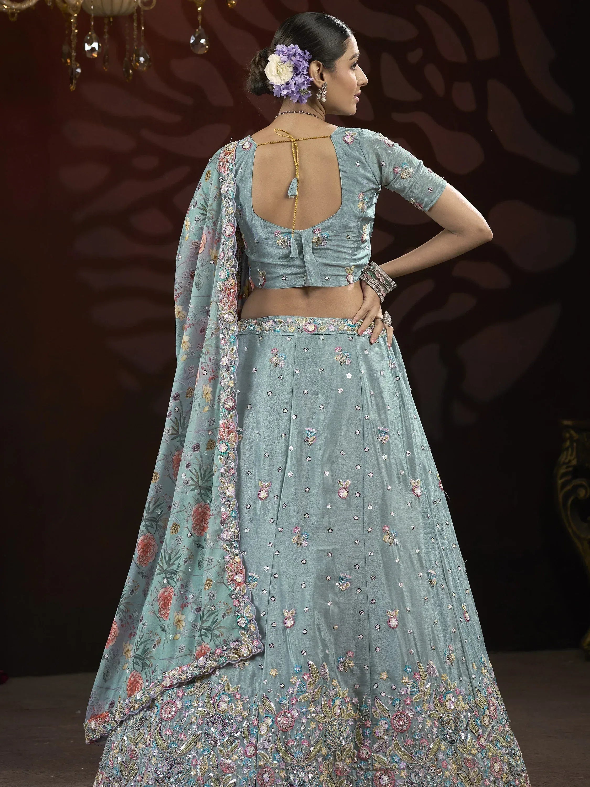 Dusty blue embroidered lehenga choli with floral dupatta, perfect for Indian weddings and festive occasions.
