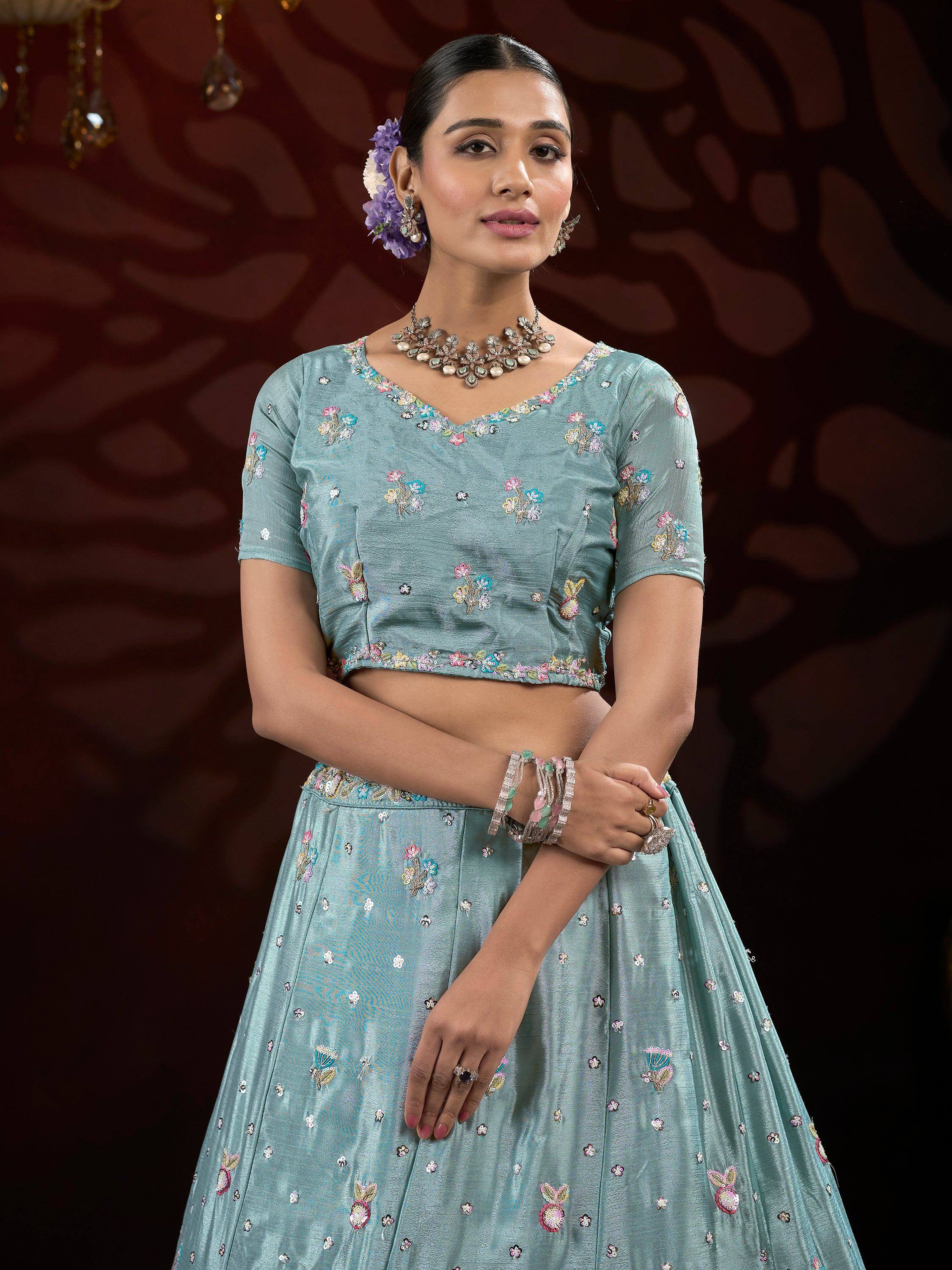 Light blue embroidered lehenga choli with floral motifs, perfect for Indian ethnic wear occasions.