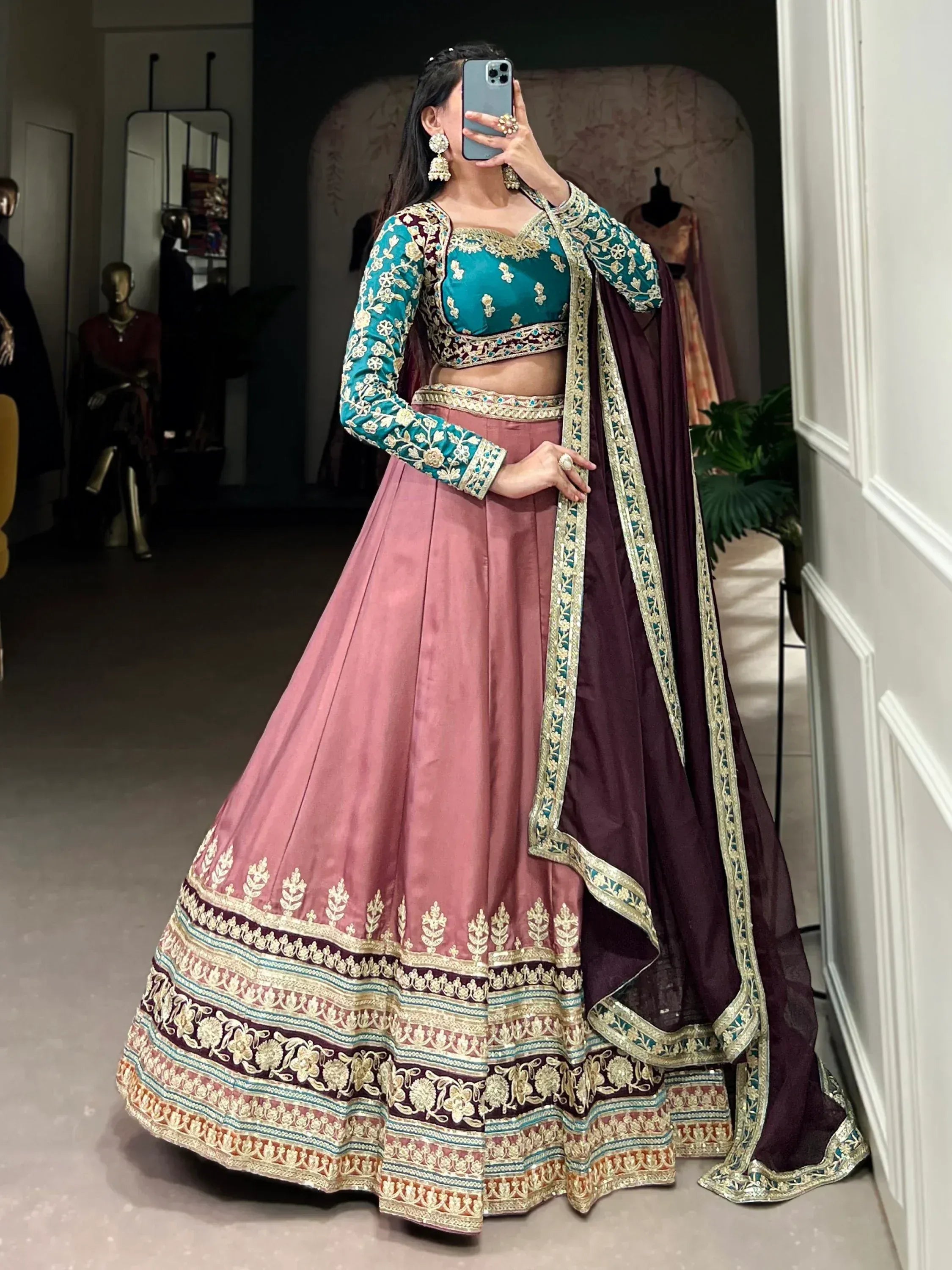 Teal and pink embroidered lehenga choli with maroon dupatta, Indian ethnic wear for weddings