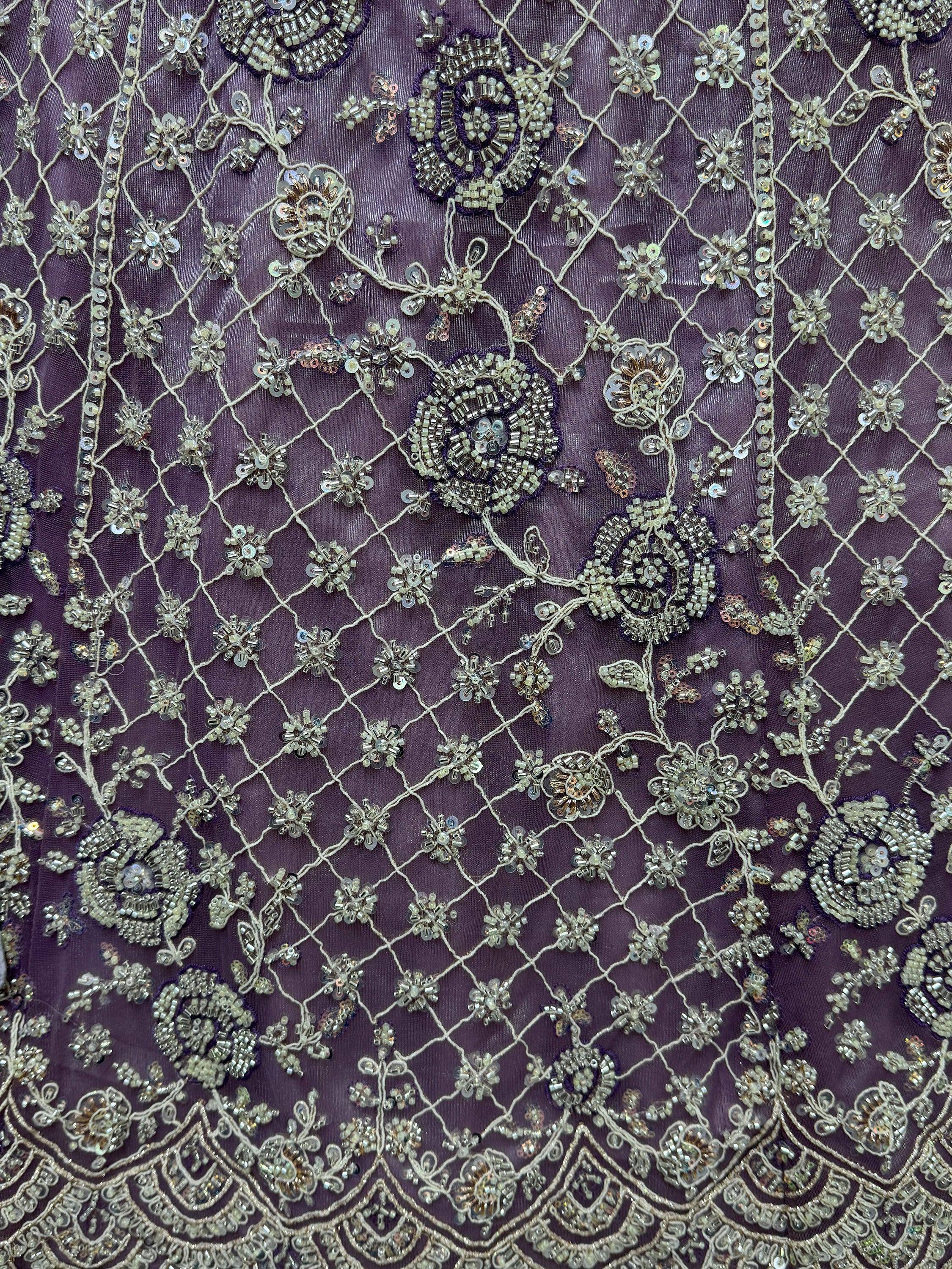 Purple ethnic wear fabric with intricate silver bead and sequin floral embroidery, perfect for designer lehenga or saree.