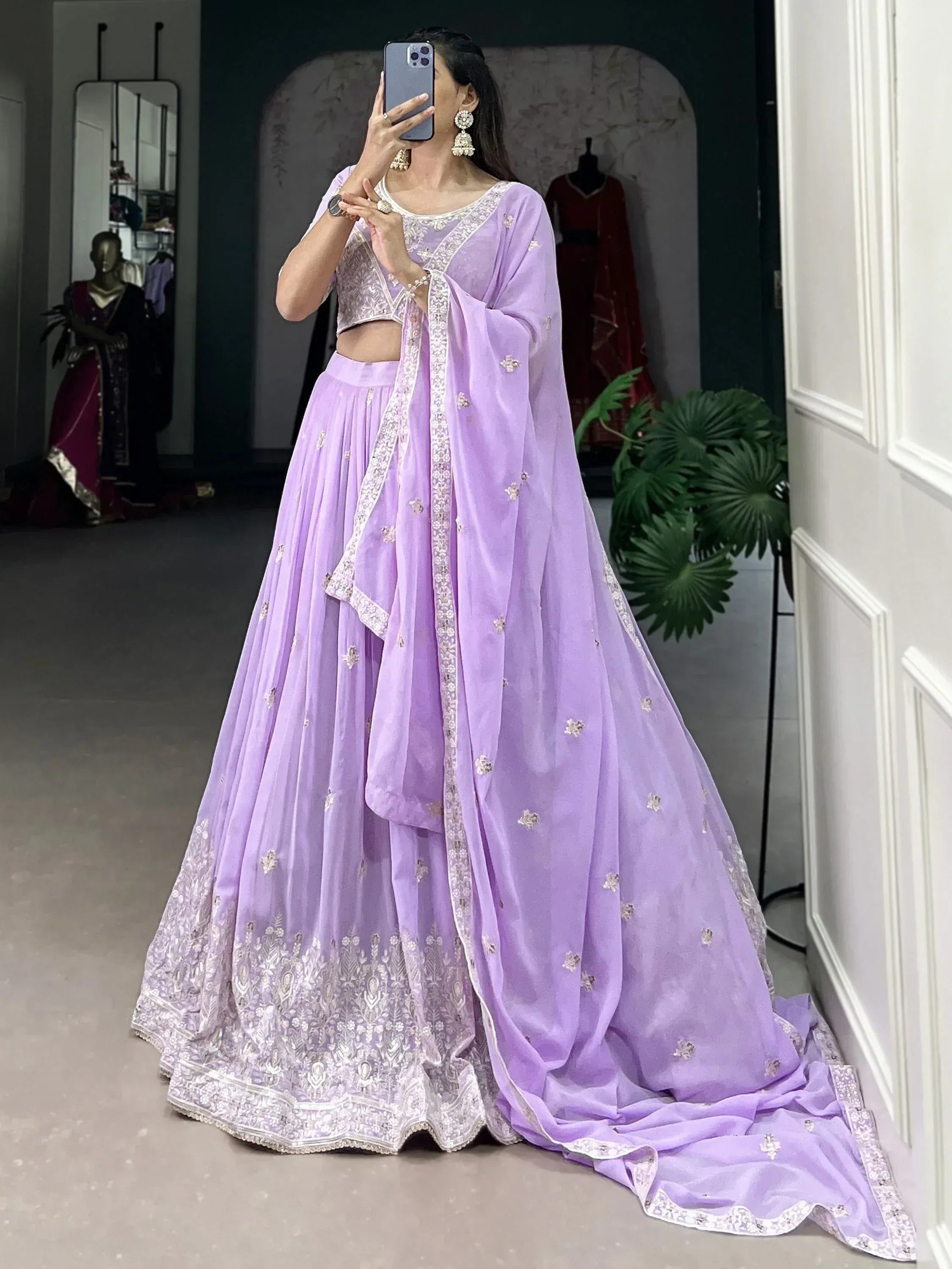 Lavender designer lehenga choli with intricate embroidery and flowing dupatta, perfect for Indian ethnic occasions.
