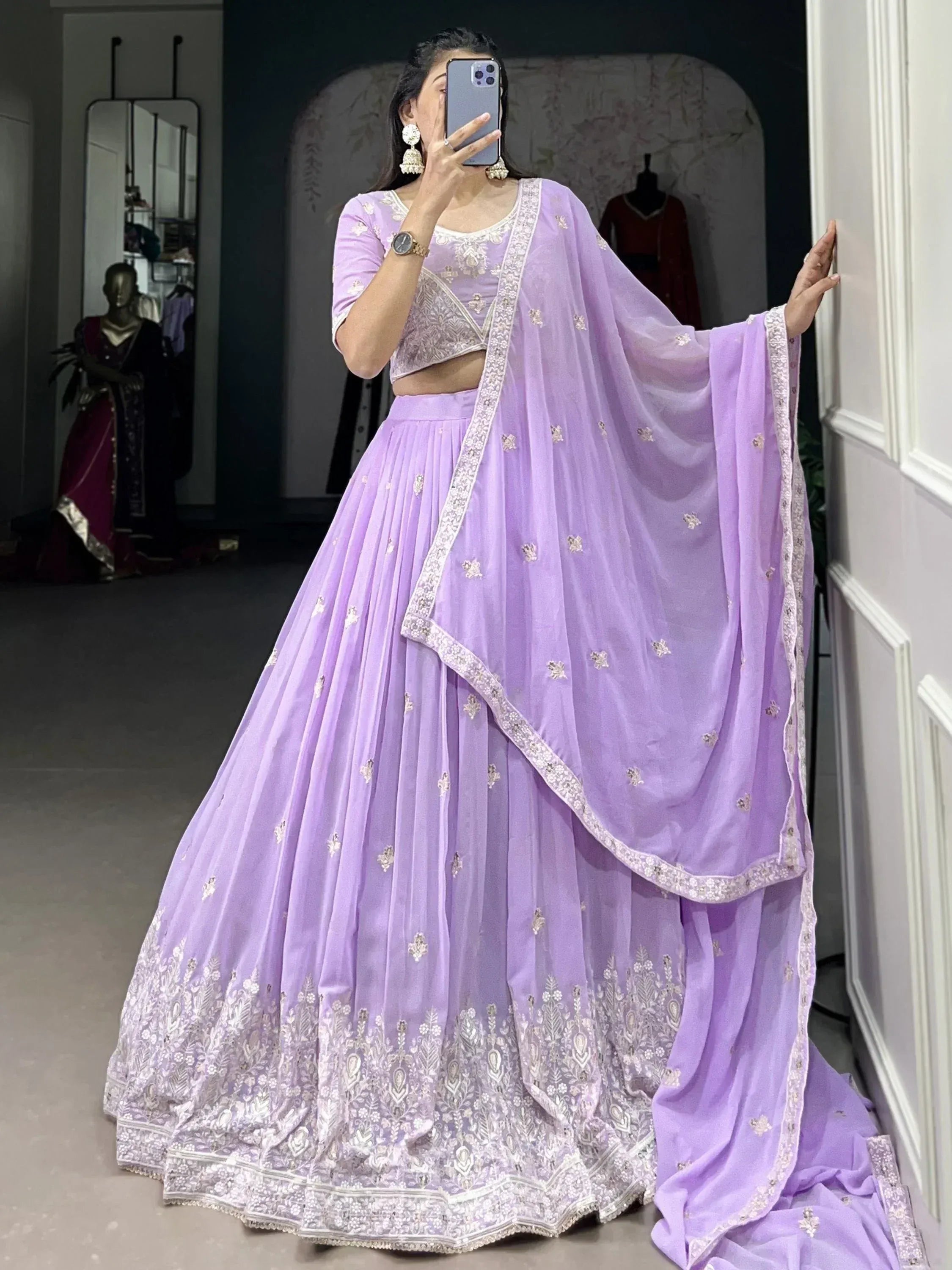 Lavender designer lehenga choli with intricate embroidery and matching dupatta, perfect for Indian ethnic occasions.