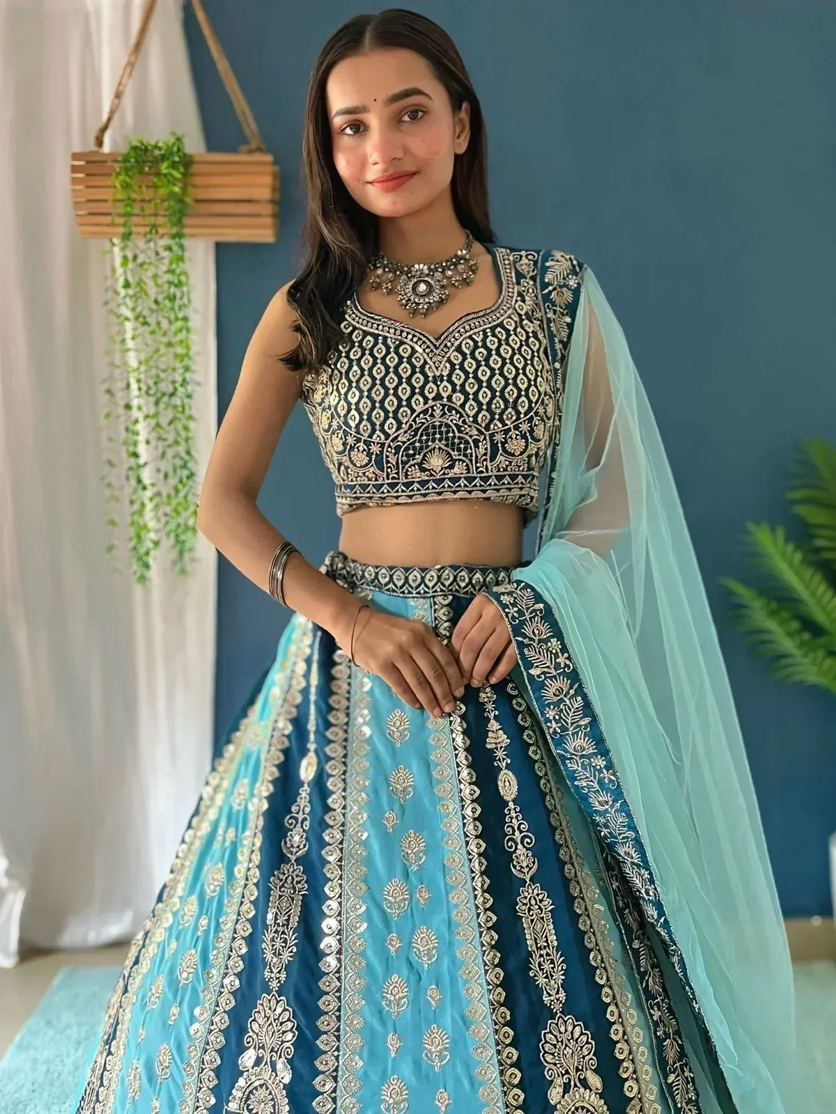 Blue embroidered lehenga choli with gold detailing, perfect for Indian ethnic wear occasions.