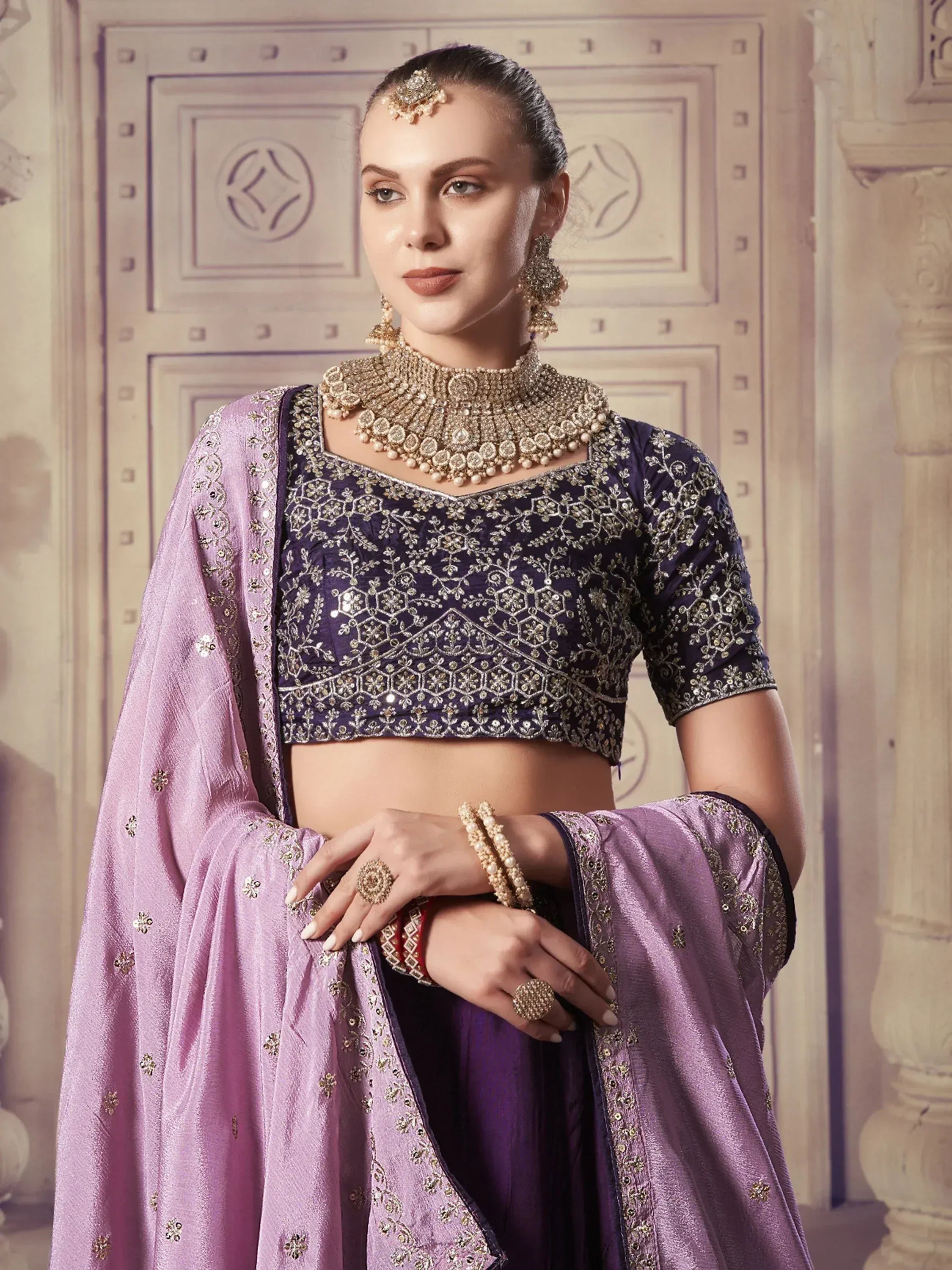 Elegant purple embroidered lehenga choli with matching dupatta, perfect for Indian ethnic wear occasions.