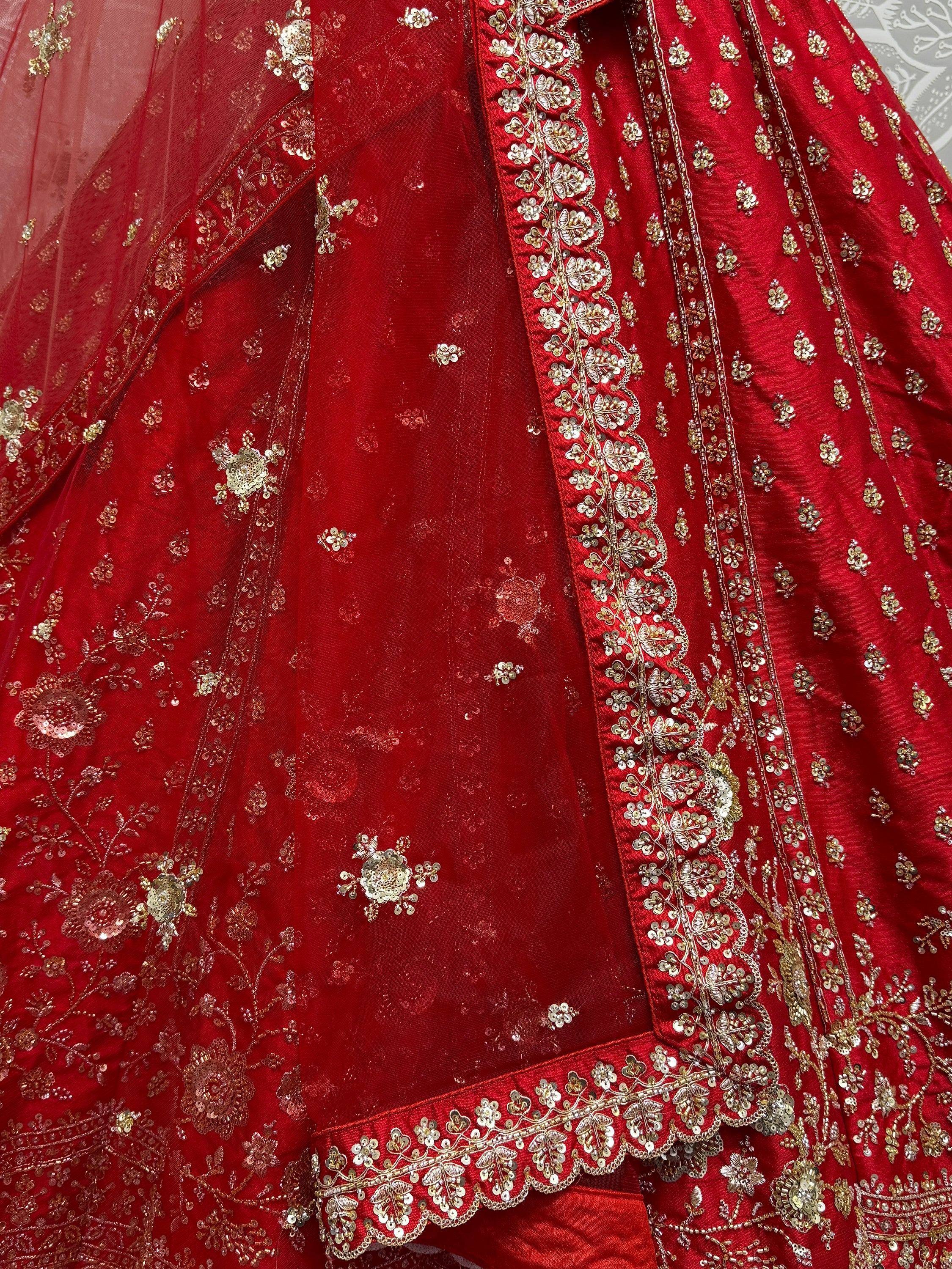 Red designer lehenga choli with gold floral embroidery and sequin work, ethnic Indian wear