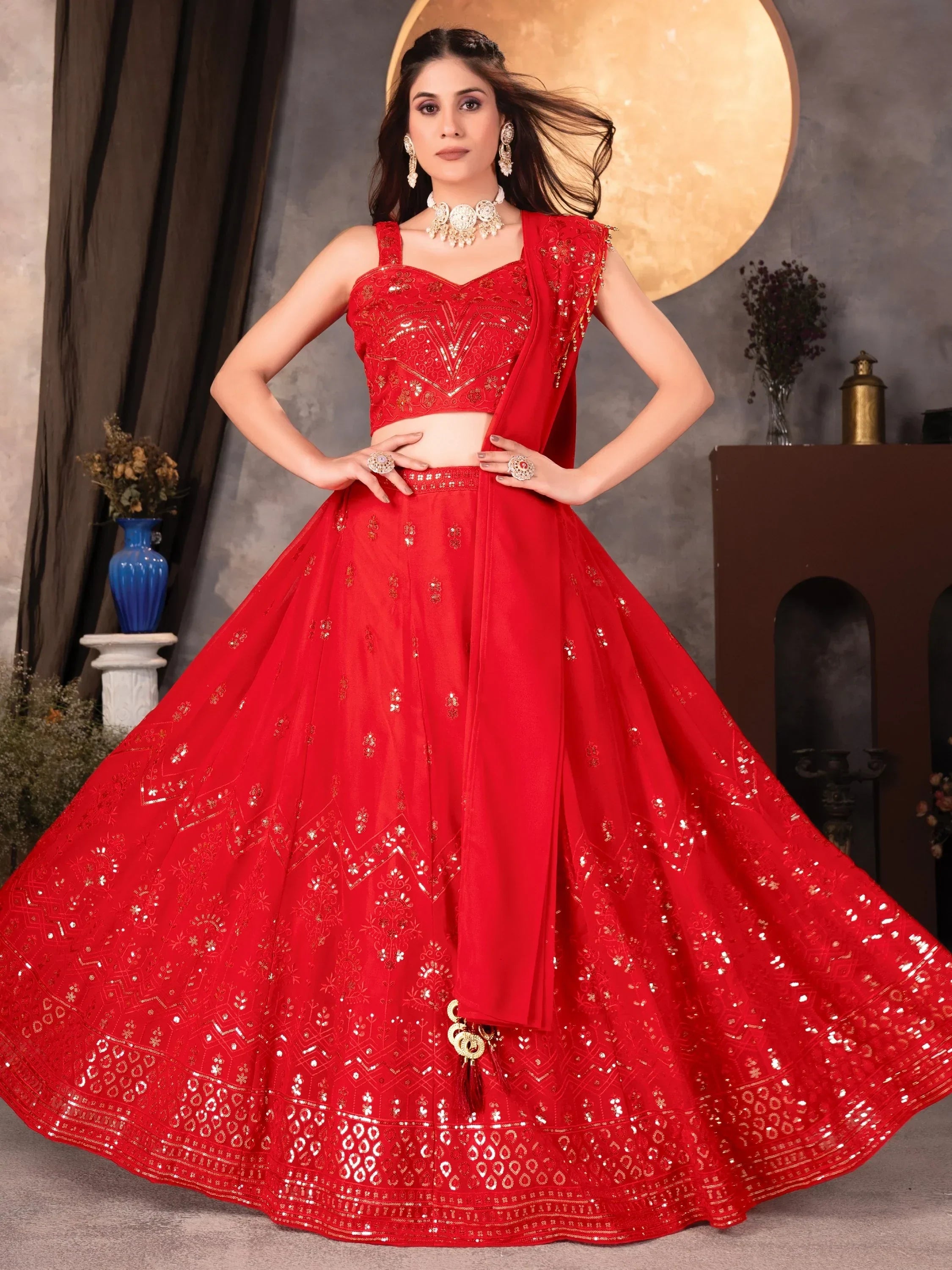 Red designer lehenga choli with gold embroidery and sequins, perfect for Indian ethnic wear occasions