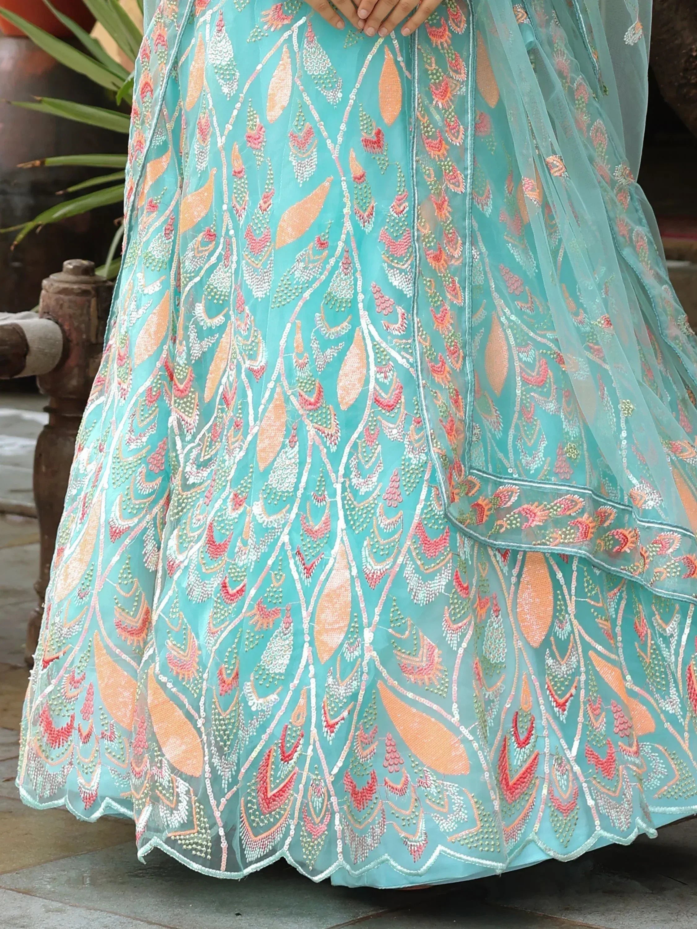 Turquoise embroidered lehenga with floral motifs and sequin detailing, perfect for Indian ethnic wear.