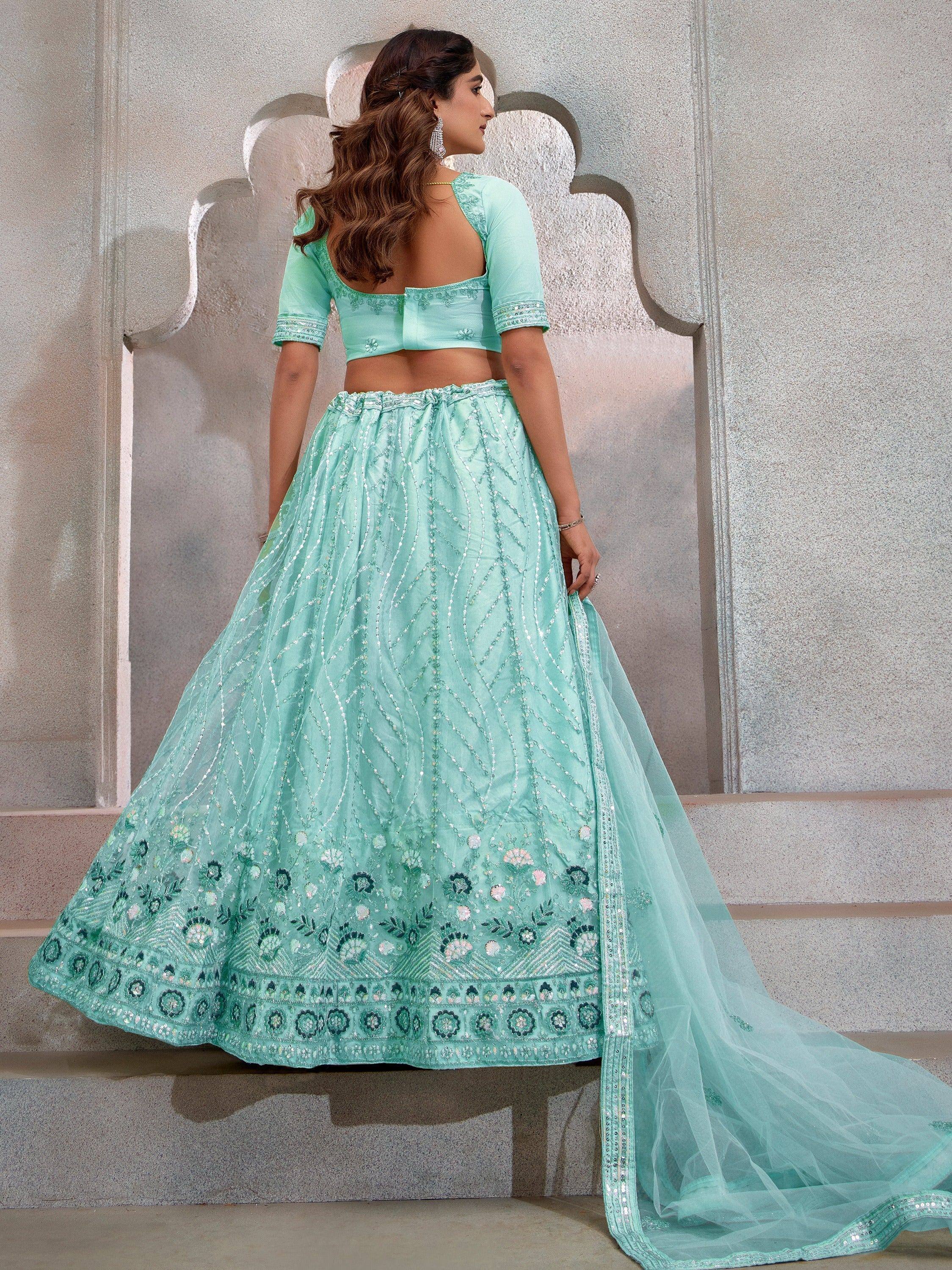 Mint green designer lehenga choli with floral embroidery and sequin work, perfect for Indian ethnic occasions.