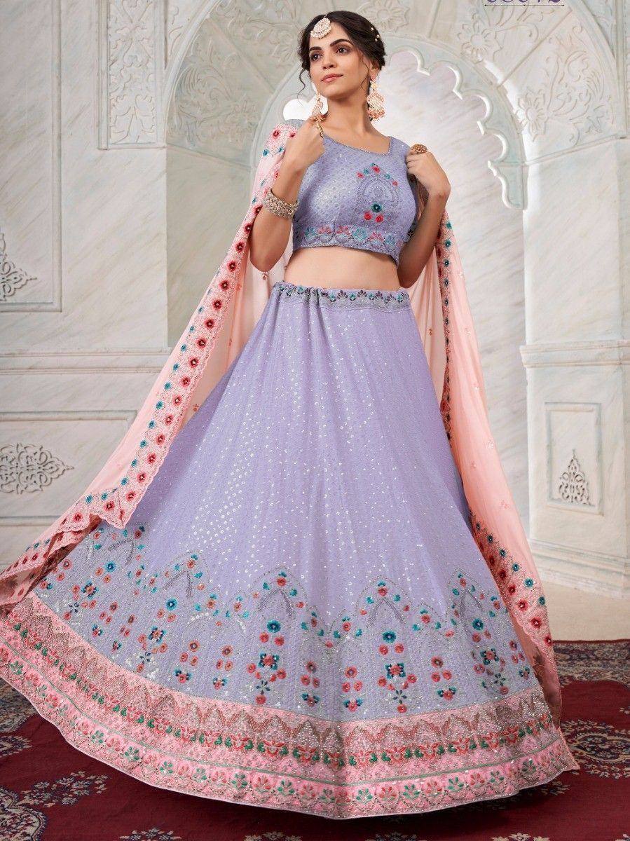Lavender designer lehenga choli with floral embroidery and pink dupatta, perfect for Indian weddings and festive occasions.