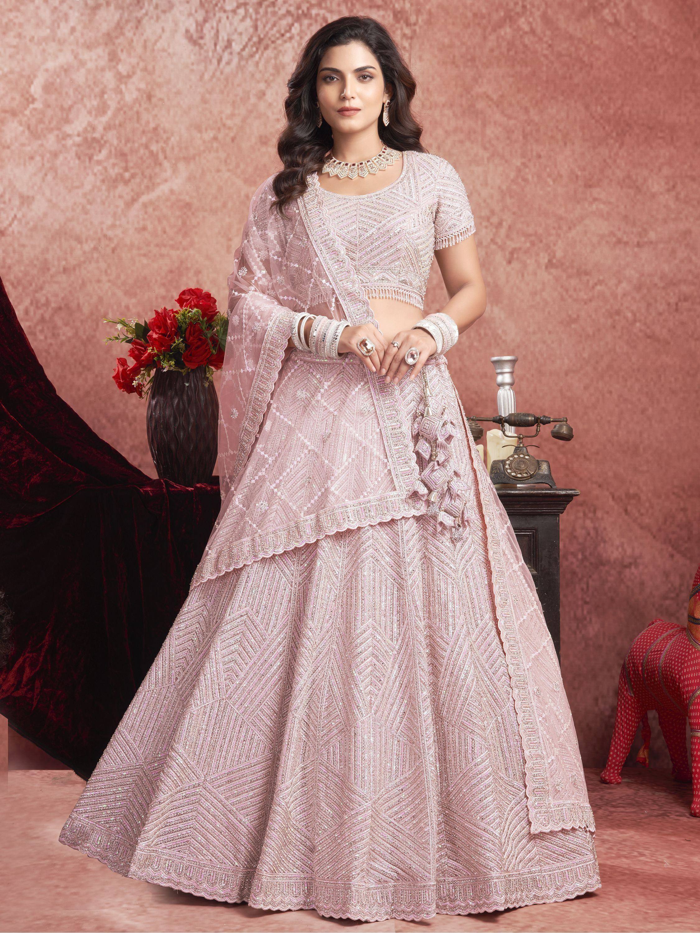 Elegant pink embroidered lehenga choli with dupatta, perfect for Indian weddings and festive occasions.