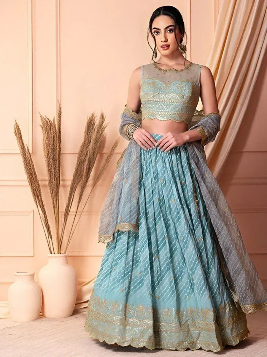 Elegant light blue lehenga choli with gold embroidery, perfect for Indian ethnic wear occasions