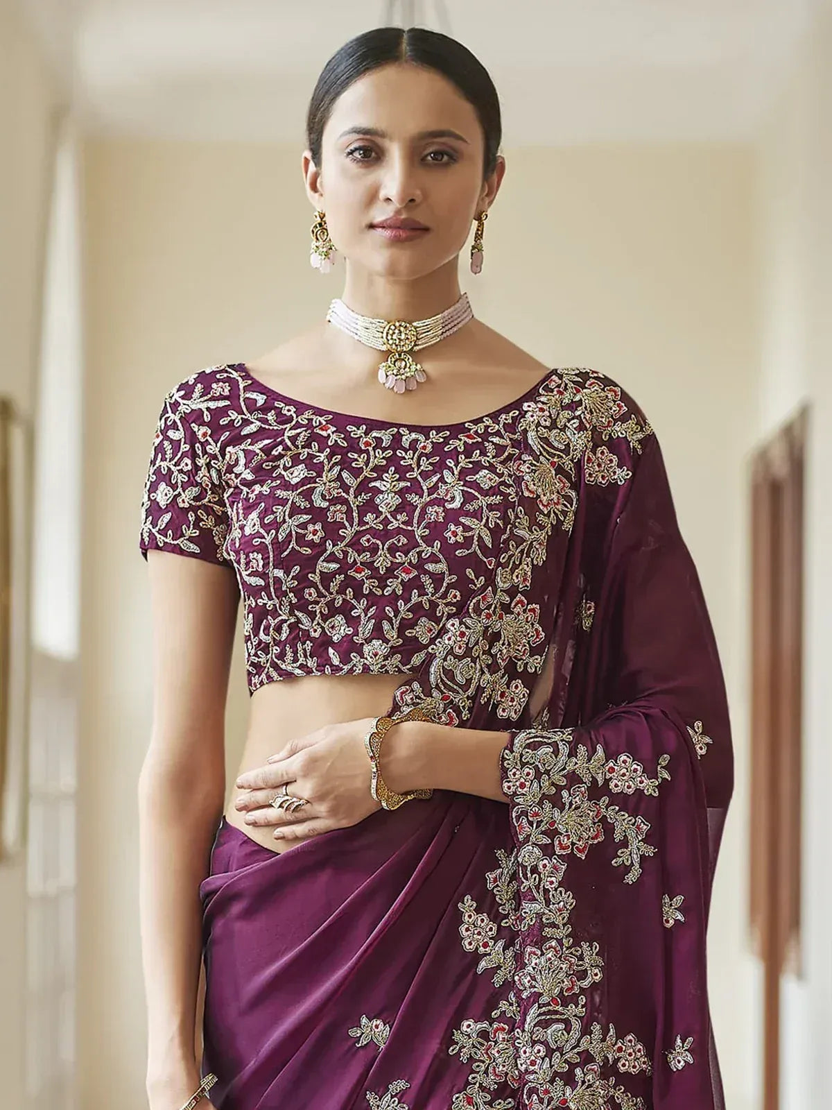 Elegant purple embroidered saree with floral zari work, perfect for Indian ethnic occasions