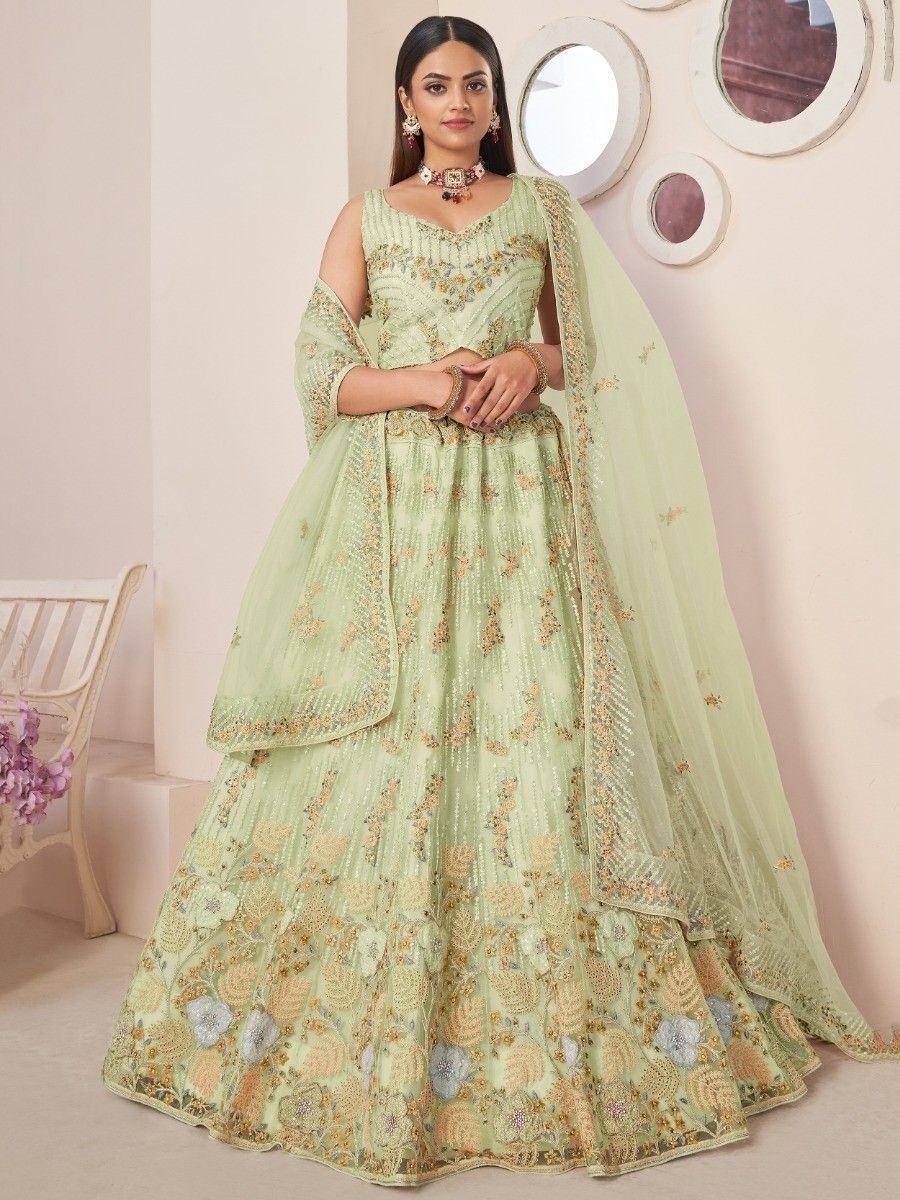 Mint green embroidered lehenga choli with floral motifs and sheer dupatta, perfect for Indian ethnic occasions.