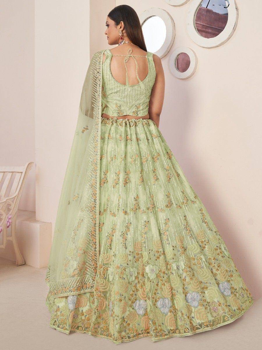 Mint green designer lehenga choli with floral embroidery and back tie detail, perfect for Indian ethnic occasions