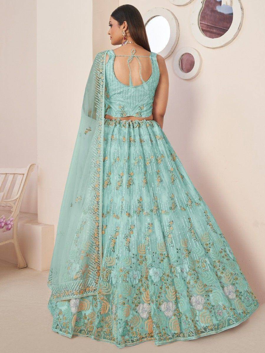 Mint green embroidered lehenga choli with floral motifs and sheer dupatta, perfect for Indian weddings or festivals.
