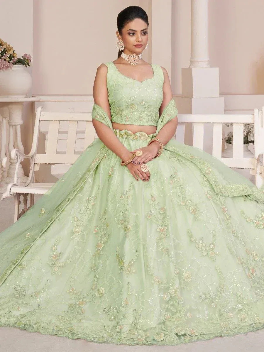 Mint green designer lehenga choli with floral embroidery, perfect for weddings and festive occasions.
