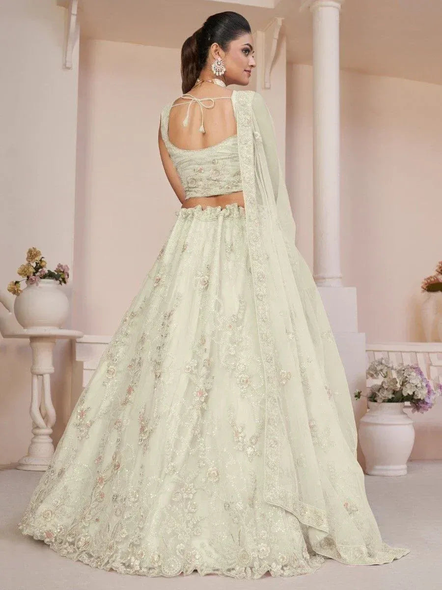 Mint green embroidered lehenga choli with back tie blouse and dupatta, perfect for weddings and festive occasions
