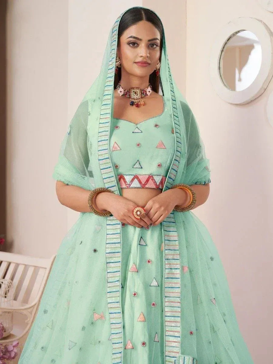 Mint green designer lehenga choli with geometric embroidery and matching dupatta for Indian ethnic wear