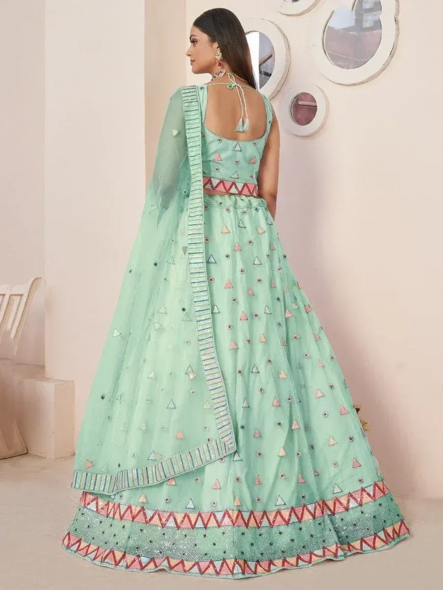 Mint green lehenga choli with geometric embroidery and mirror work, perfect for Indian ethnic occasions