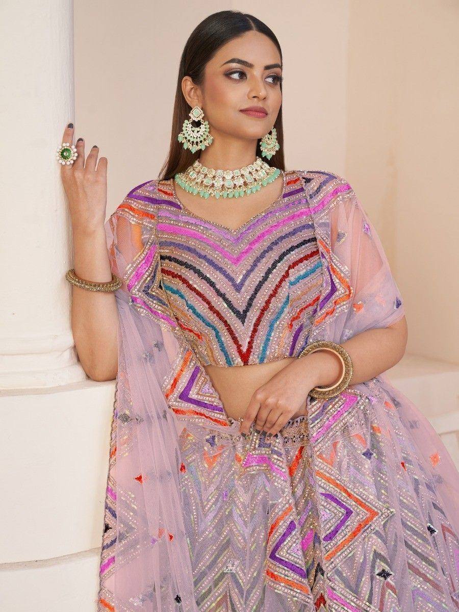 Colorful embroidered lehenga choli with geometric patterns, perfect for Indian ethnic wear occasions