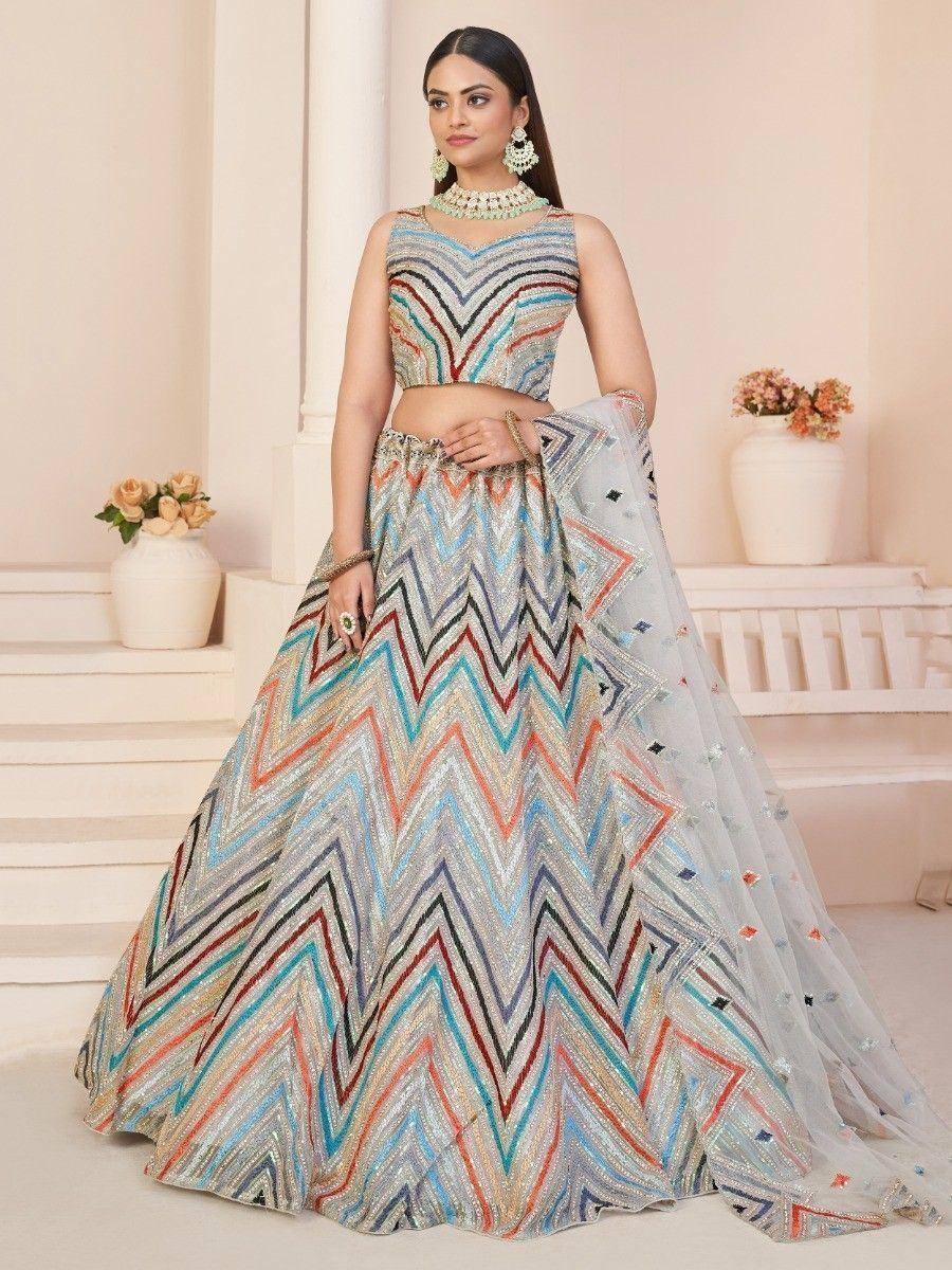 Multicolor zigzag embroidered lehenga choli with sheer dupatta, perfect for Indian ethnic occasions
