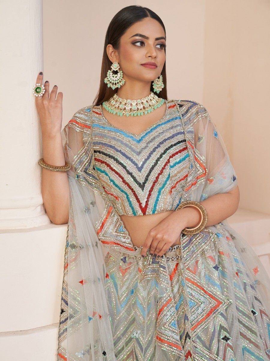 Designer lehenga choli with colorful geometric embroidery, perfect for Indian ethnic wear occasions