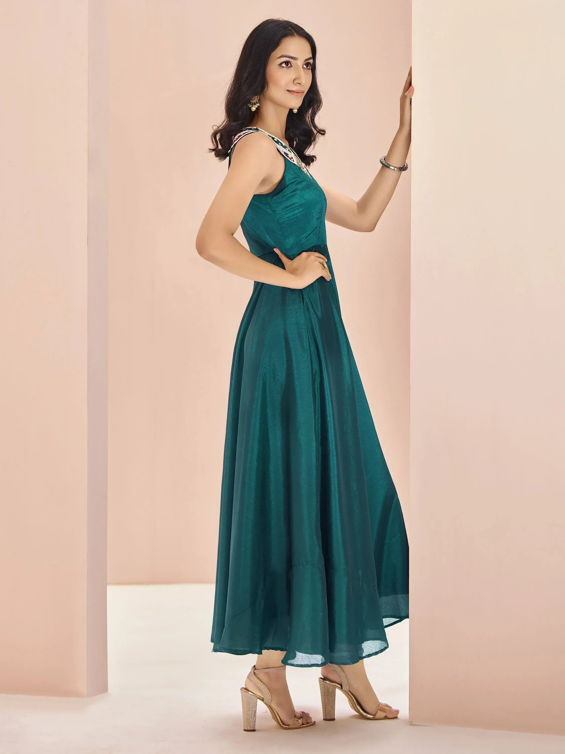 Emerald green ethnic gown with embroidered neckline, perfect for Indian occasions and parties