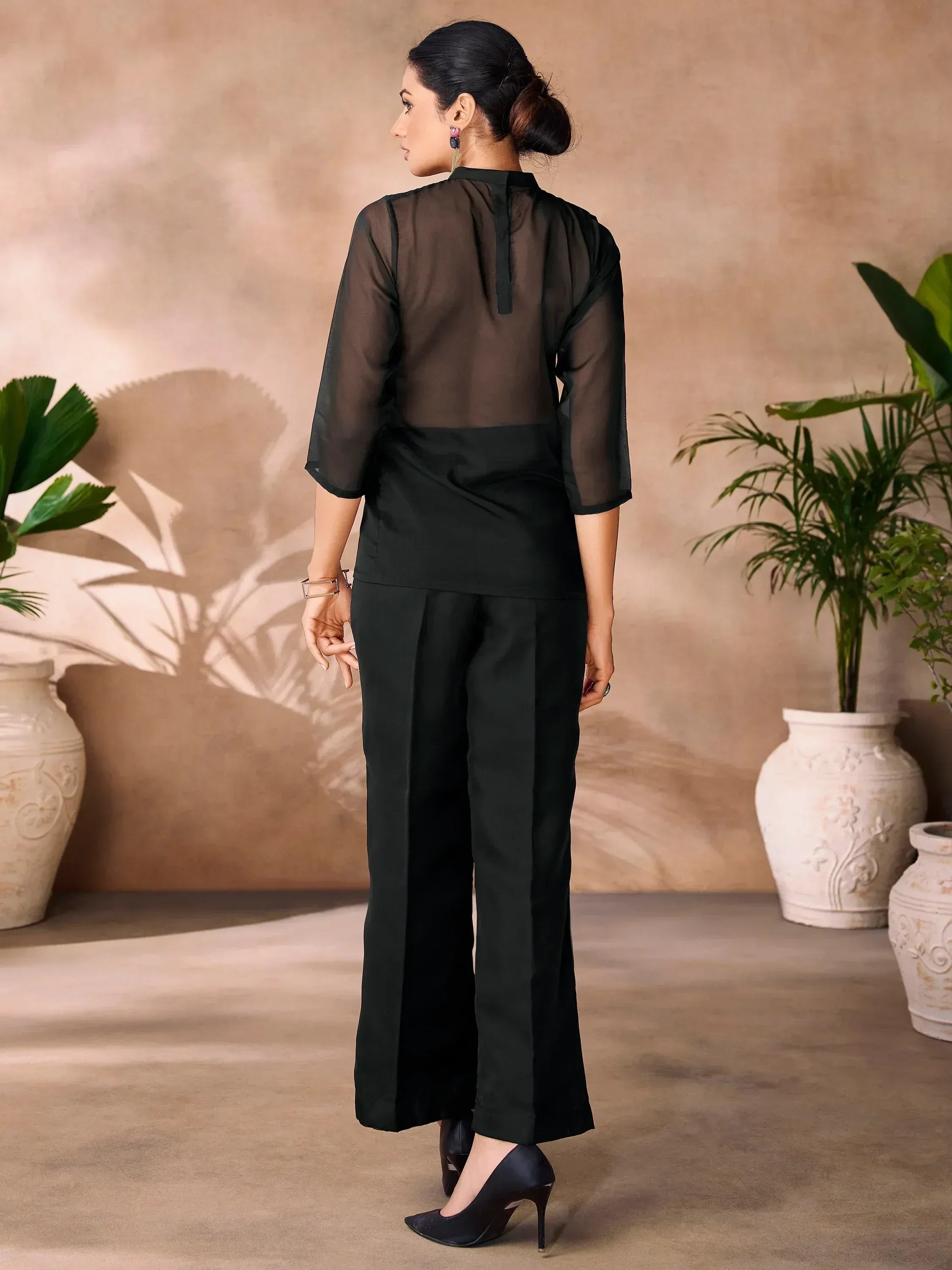 Black sheer top with solid back and wide-leg pants, ethnic wear outfit for women