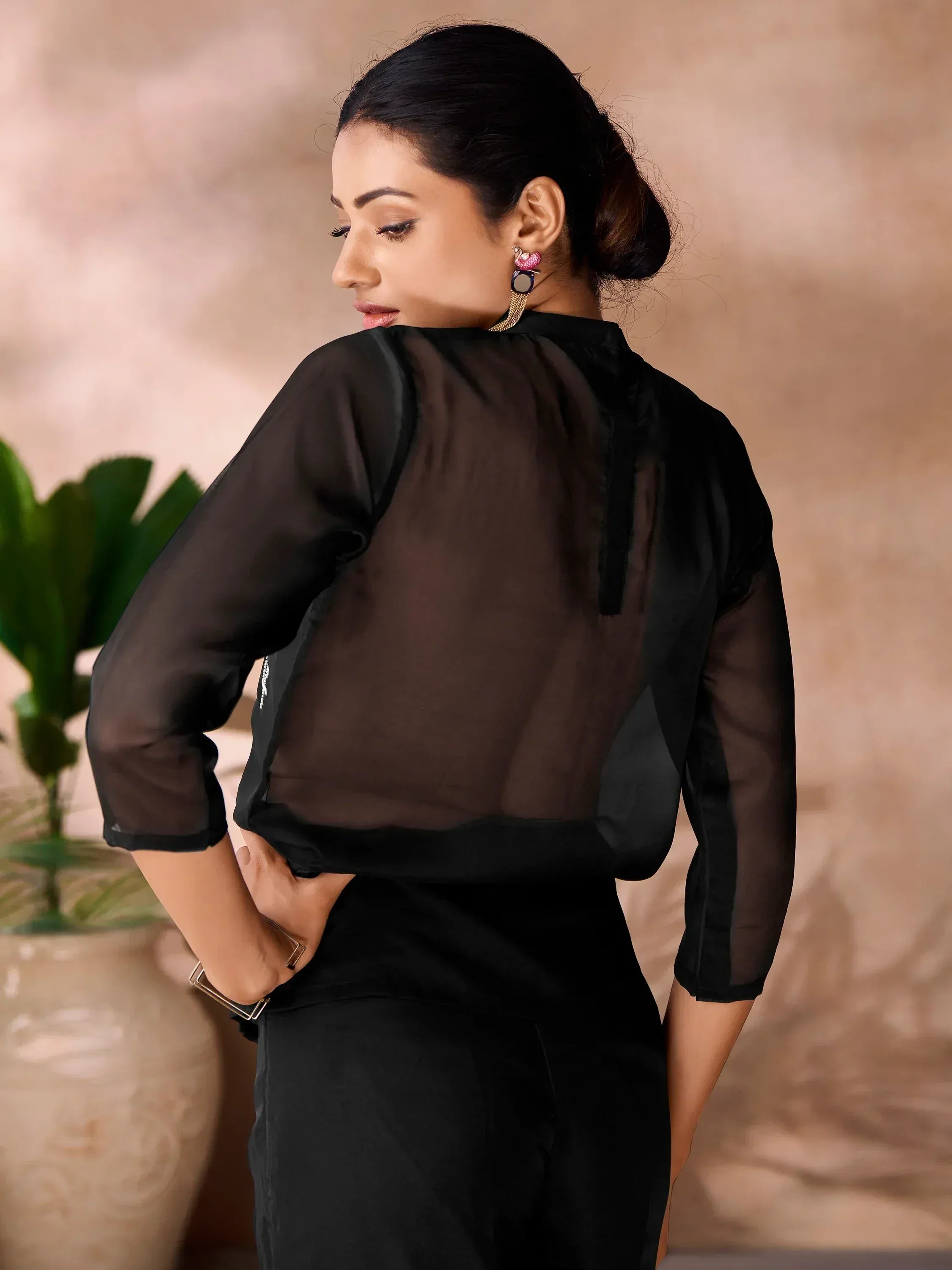 Black sheer ethnic top with 3/4 sleeves, back view, paired with matching pants for modern Indian wear