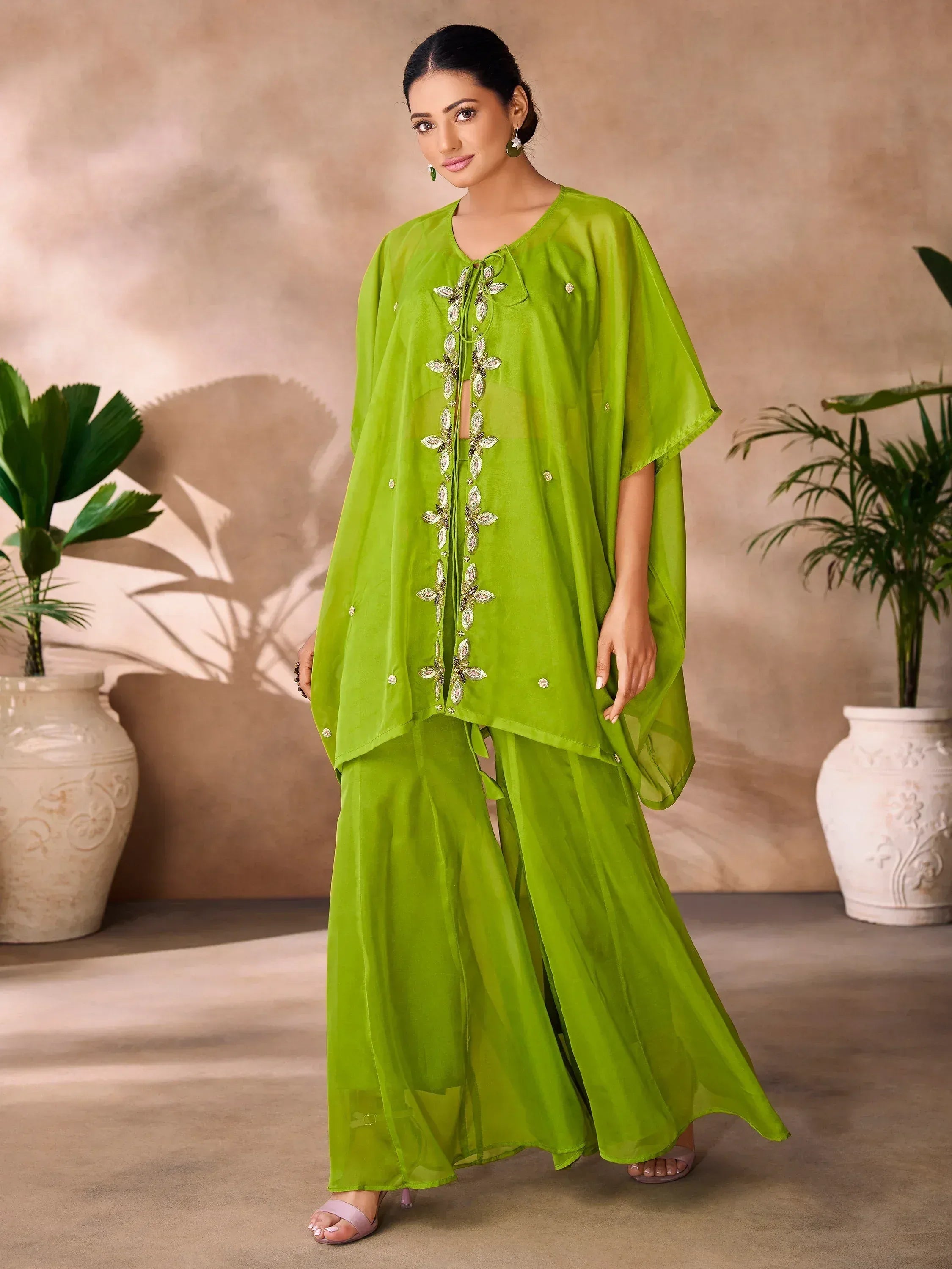 Woman in lime green embroidered ethnic gown with palazzo pants, Indian traditional wear