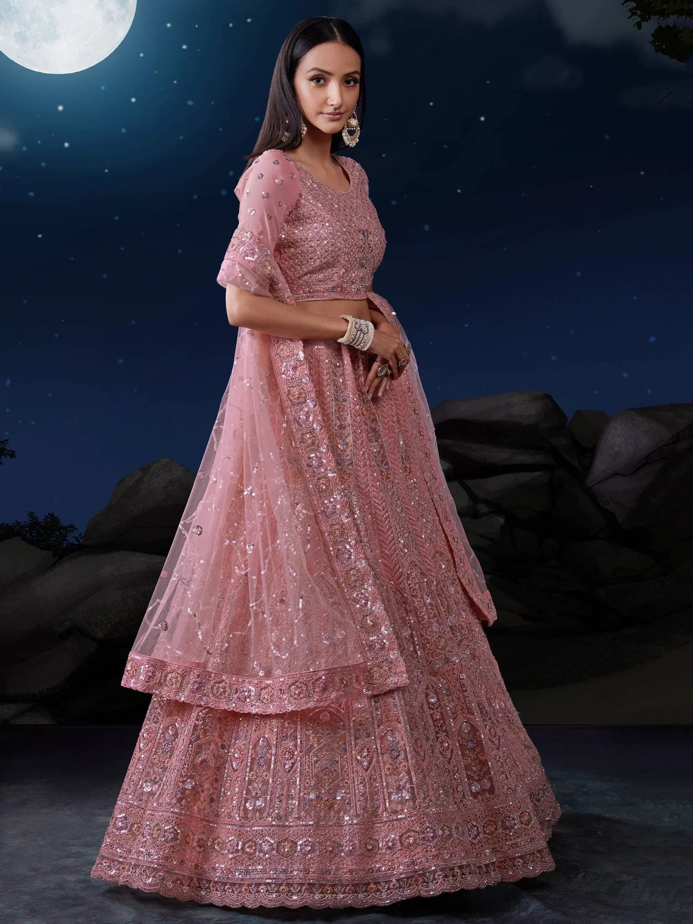 Pink embroidered lehenga choli with sequins, perfect for Indian weddings under moonlight