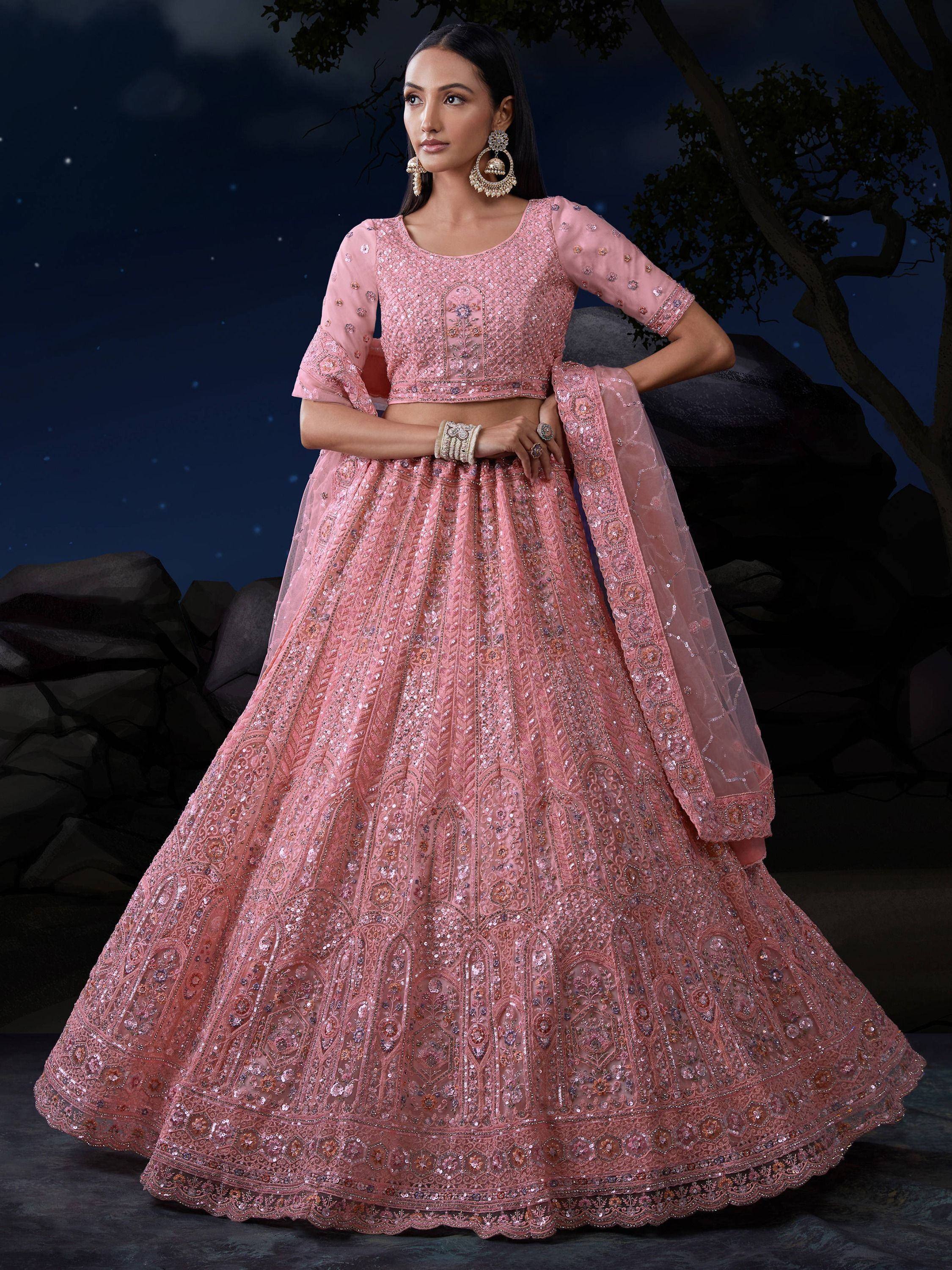 Pink embroidered lehenga choli with sequins, perfect for Indian weddings and festive occasions.
