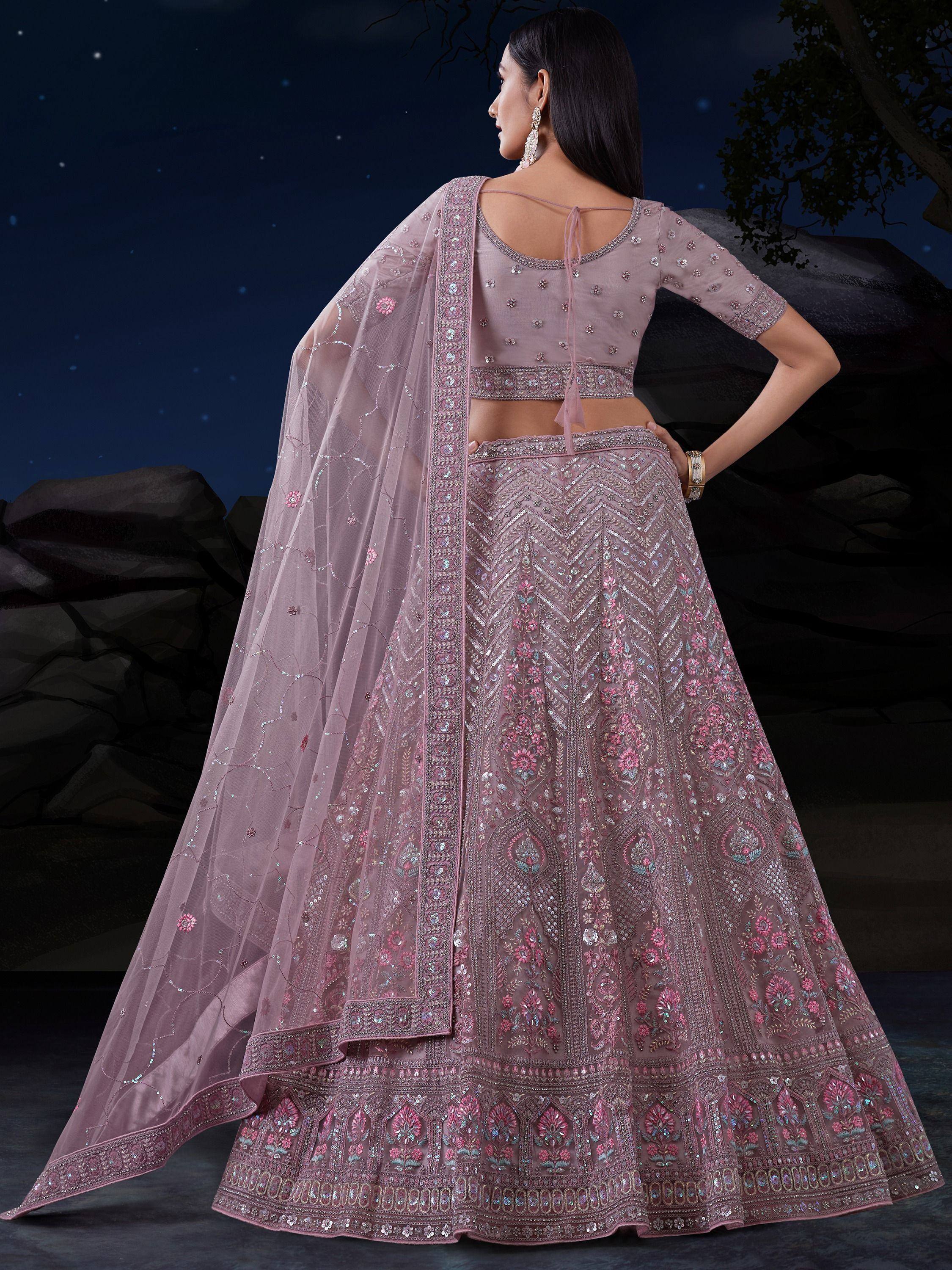 Elegant mauve lehenga choli with intricate floral embroidery and sequin work, perfect for Indian weddings and festive occasions.