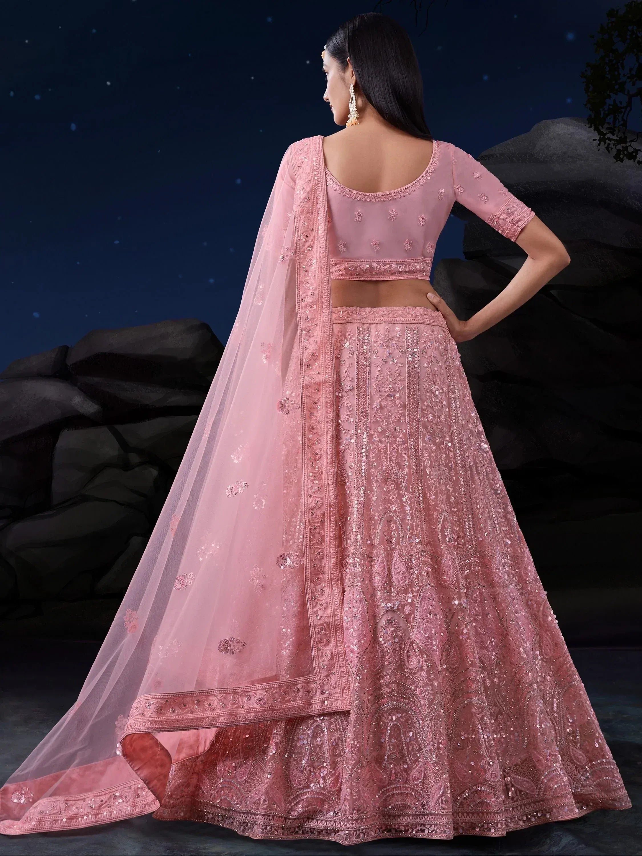 Pink embroidered lehenga choli with sheer dupatta, perfect for Indian weddings and festive occasions.