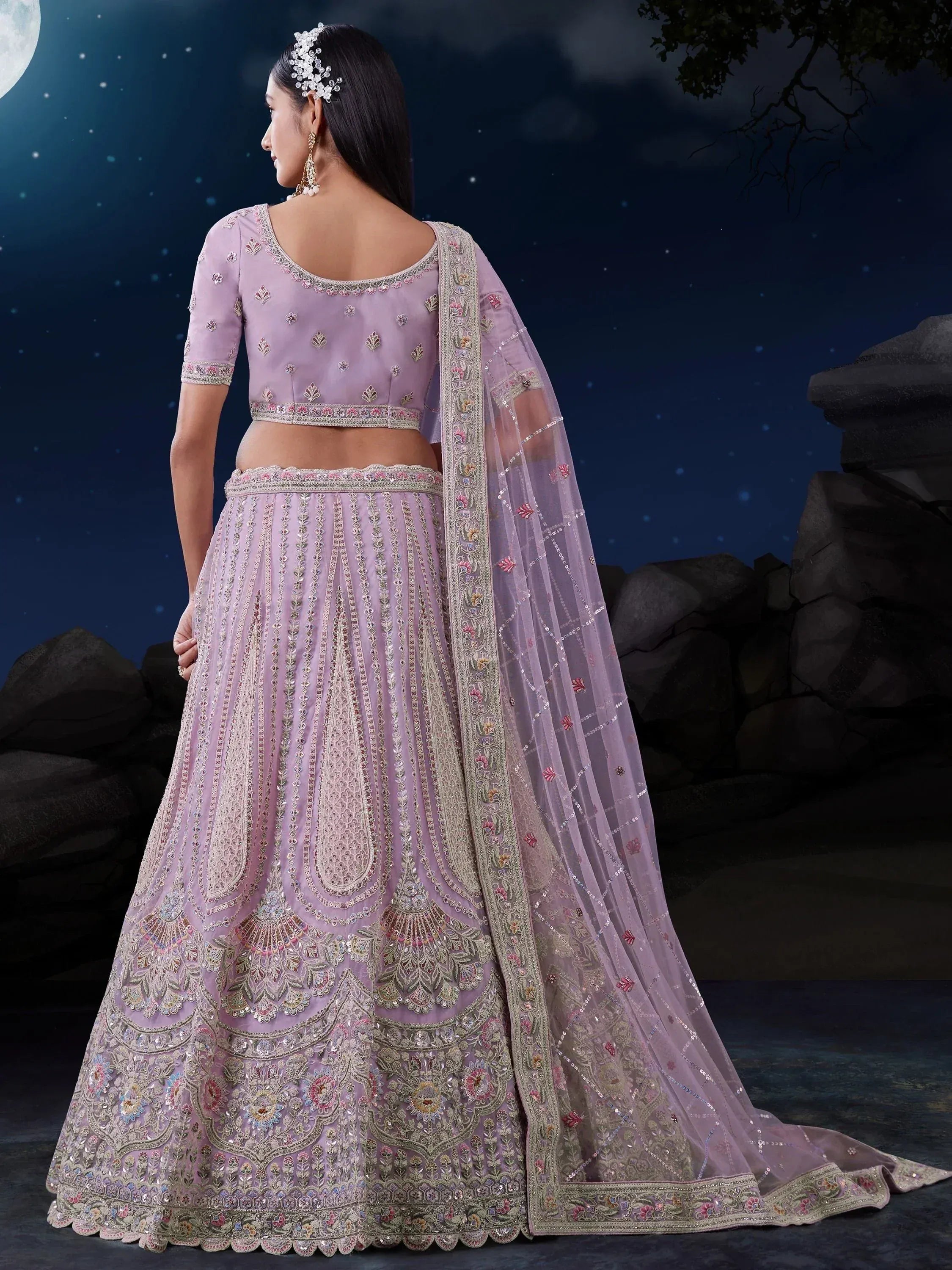 Lavender designer lehenga choli with intricate embroidery, perfect for Indian weddings and festive occasions.